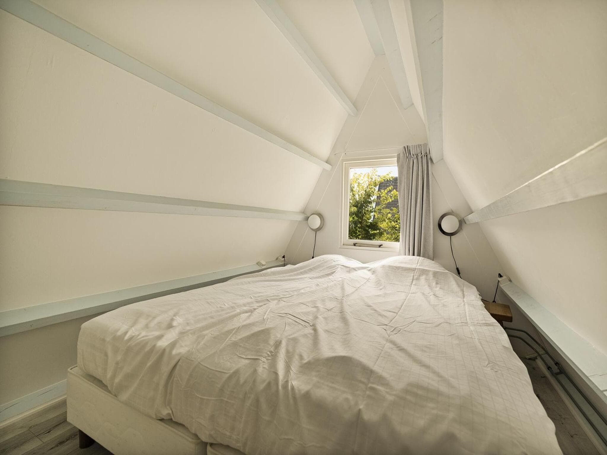 Een slaapkamer van Sandepark 37 in Groote Keeten