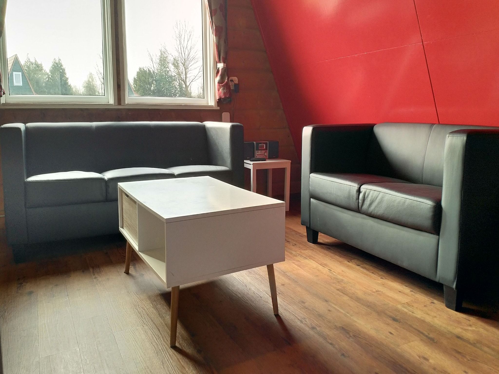 De woonkamer van Vakantiepark Eigen Wijze 1 in Bant