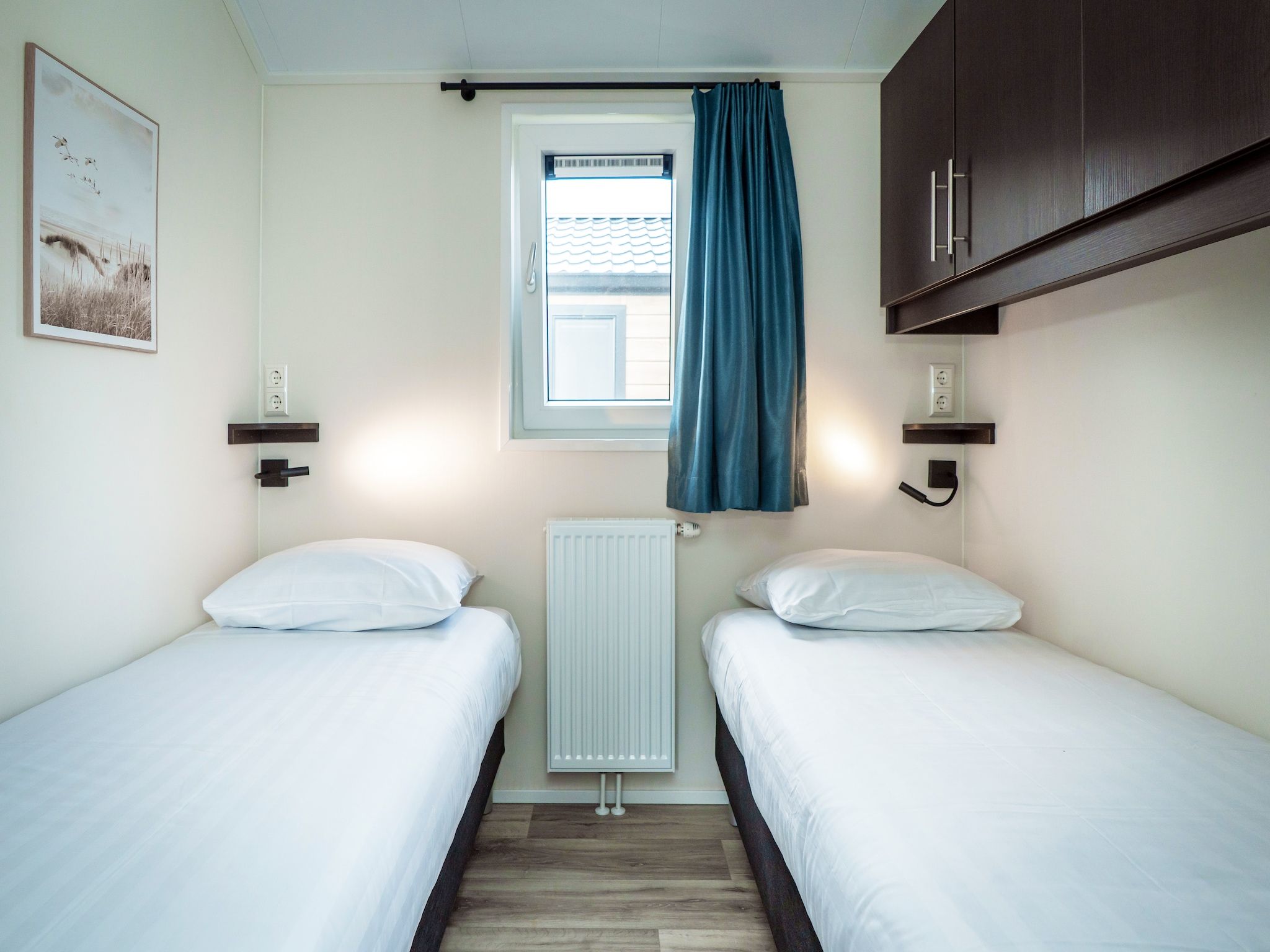 Een slaapkamer van Chalet Comfort in Den Burg