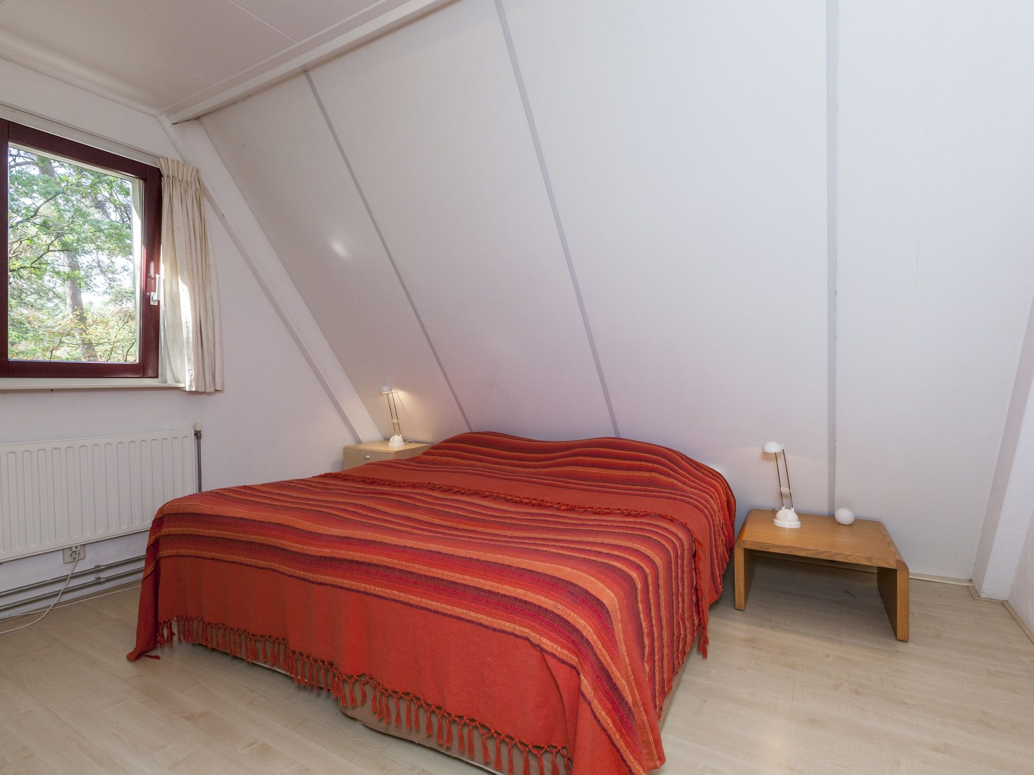 Een slaapkamer van Kleine Vos in Nunspeet