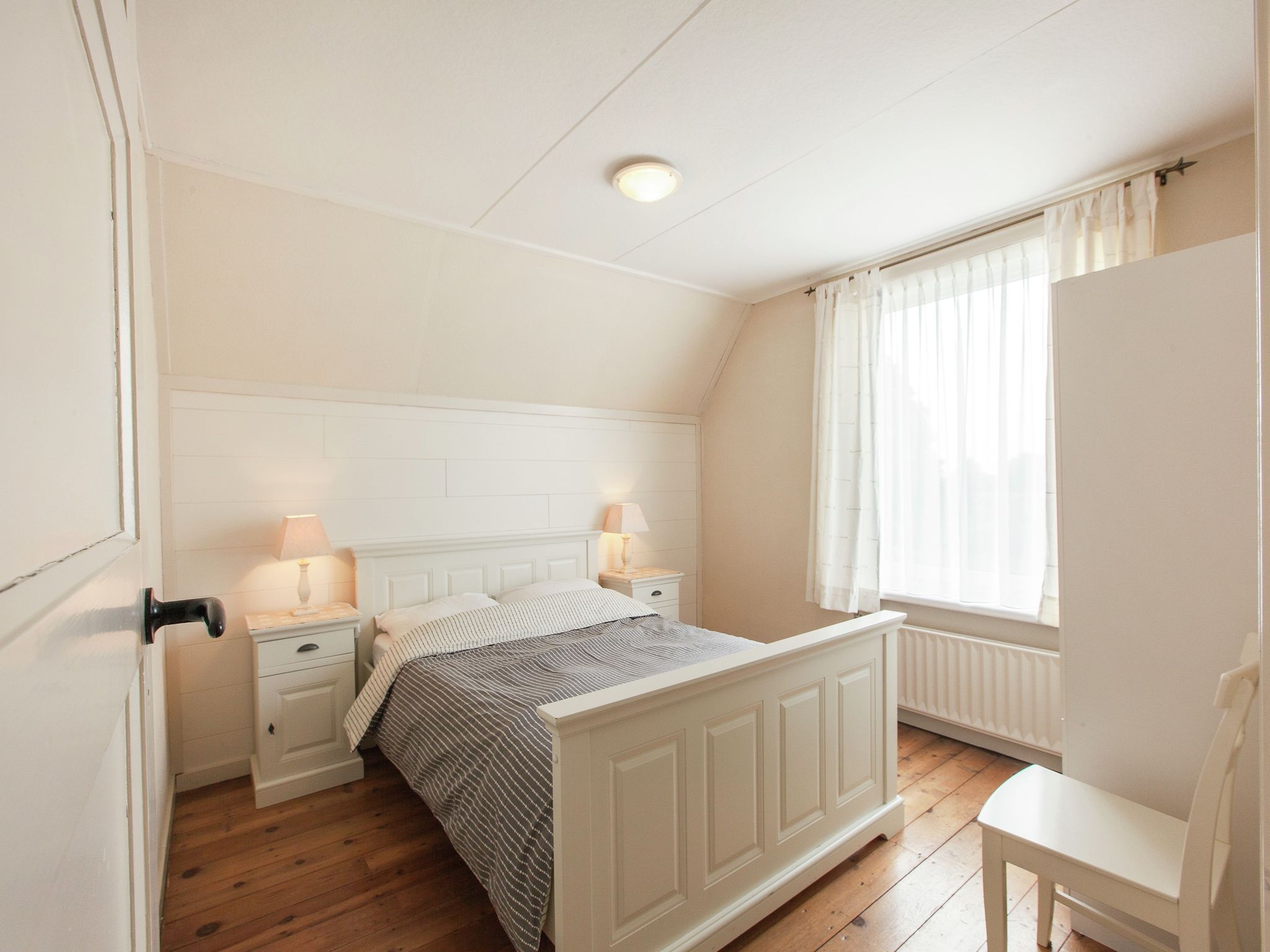 Een slaapkamer van De Paardenmarkt in Aardenburg