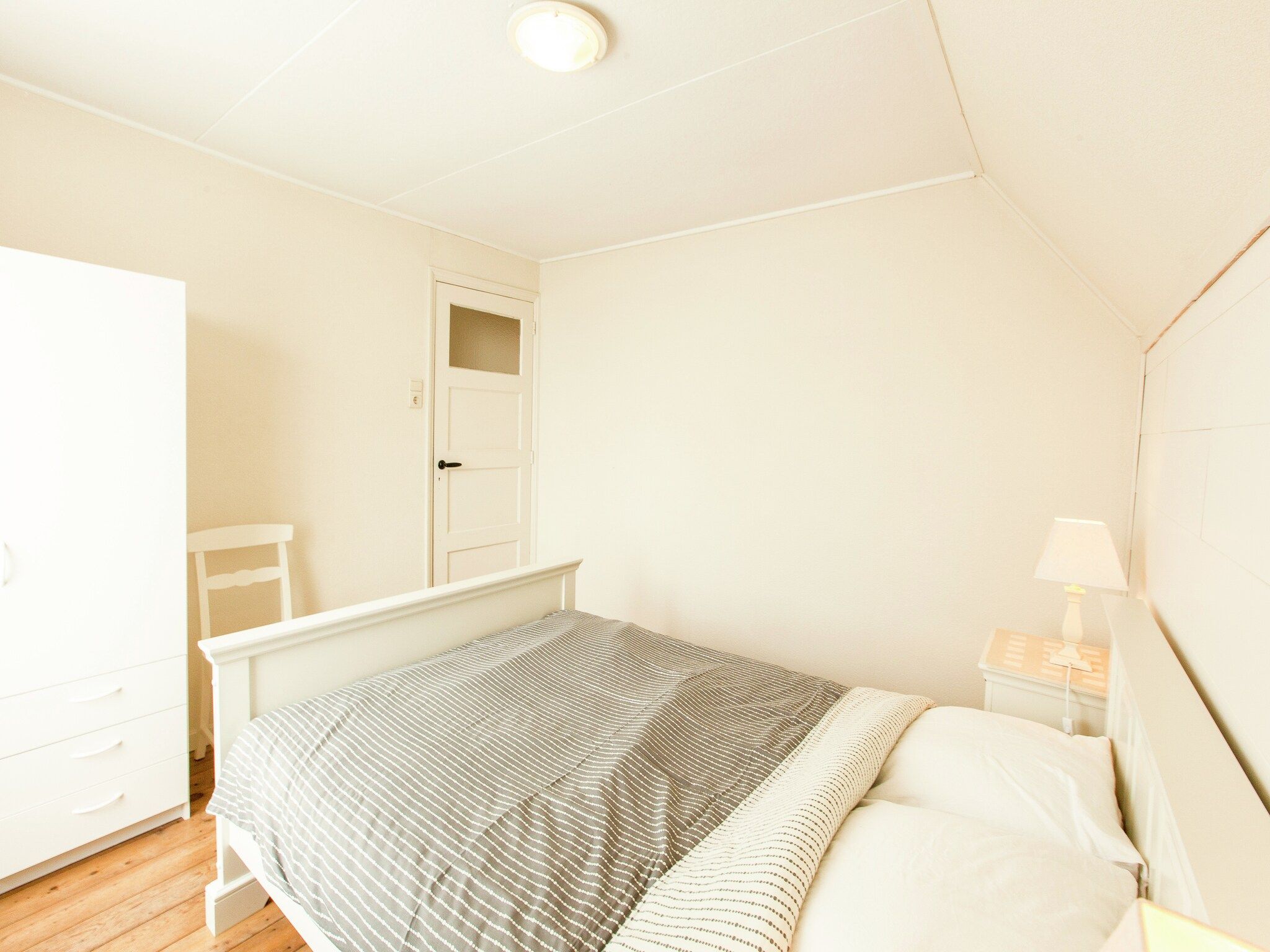 Een slaapkamer van De Paardenmarkt in Aardenburg