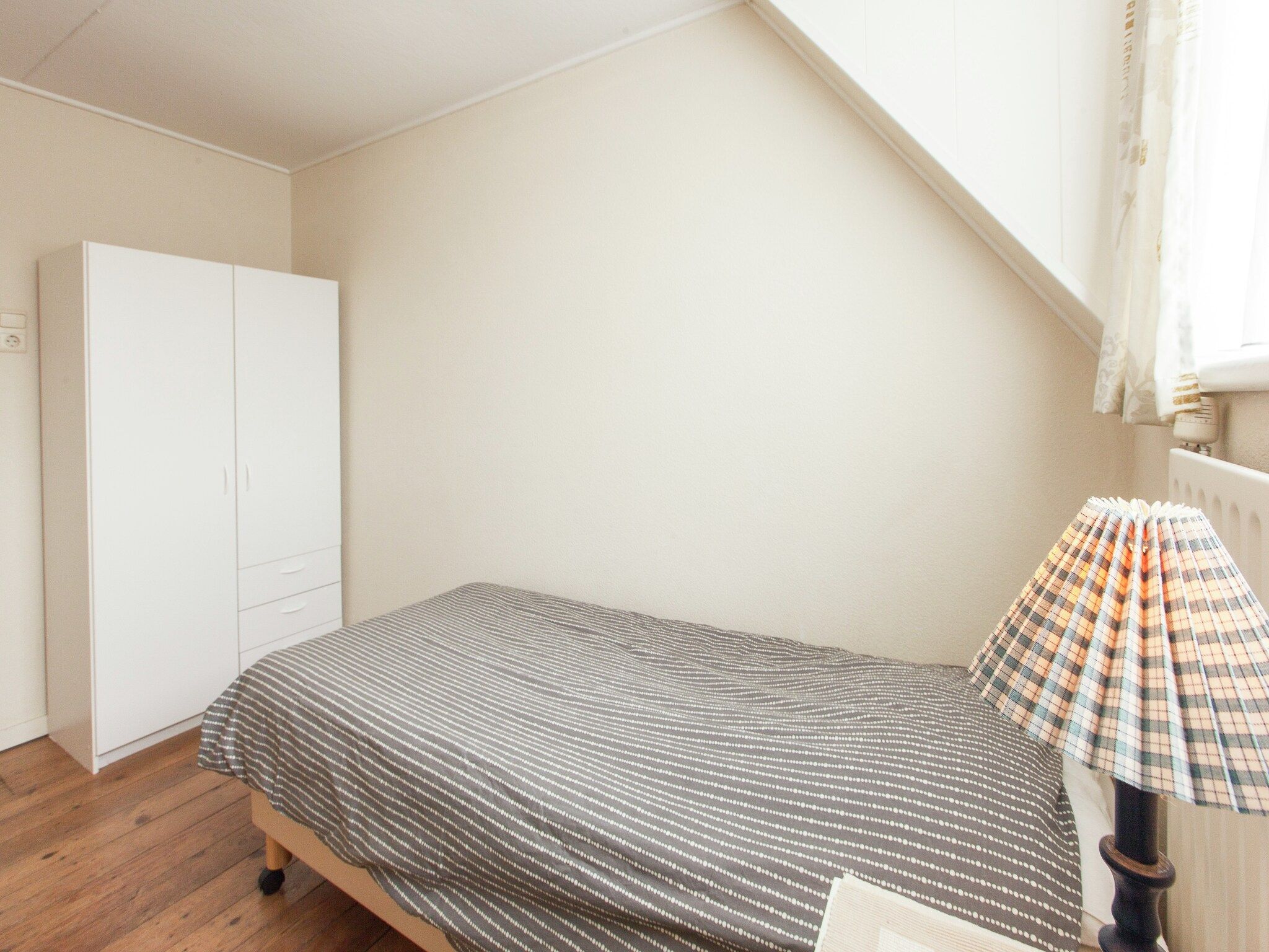 Een slaapkamer van De Paardenmarkt in Aardenburg