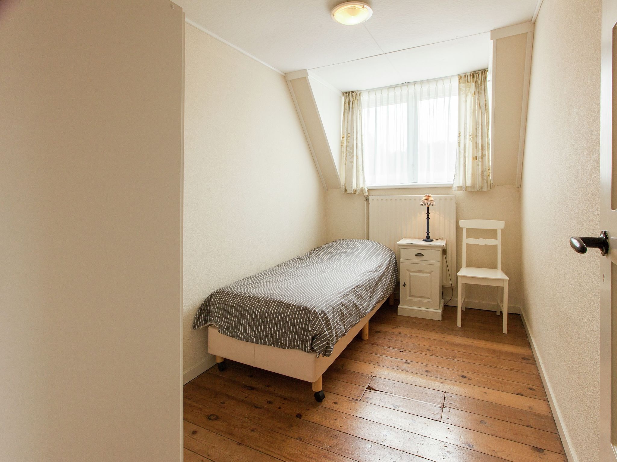 Een slaapkamer van De Paardenmarkt in Aardenburg