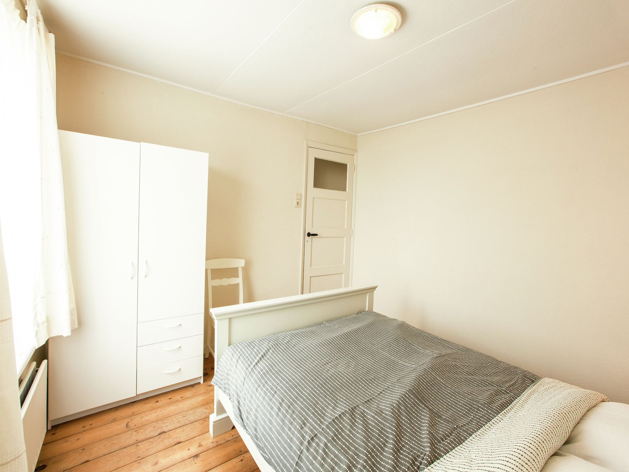 Een slaapkamer van De Paardenmarkt in Aardenburg