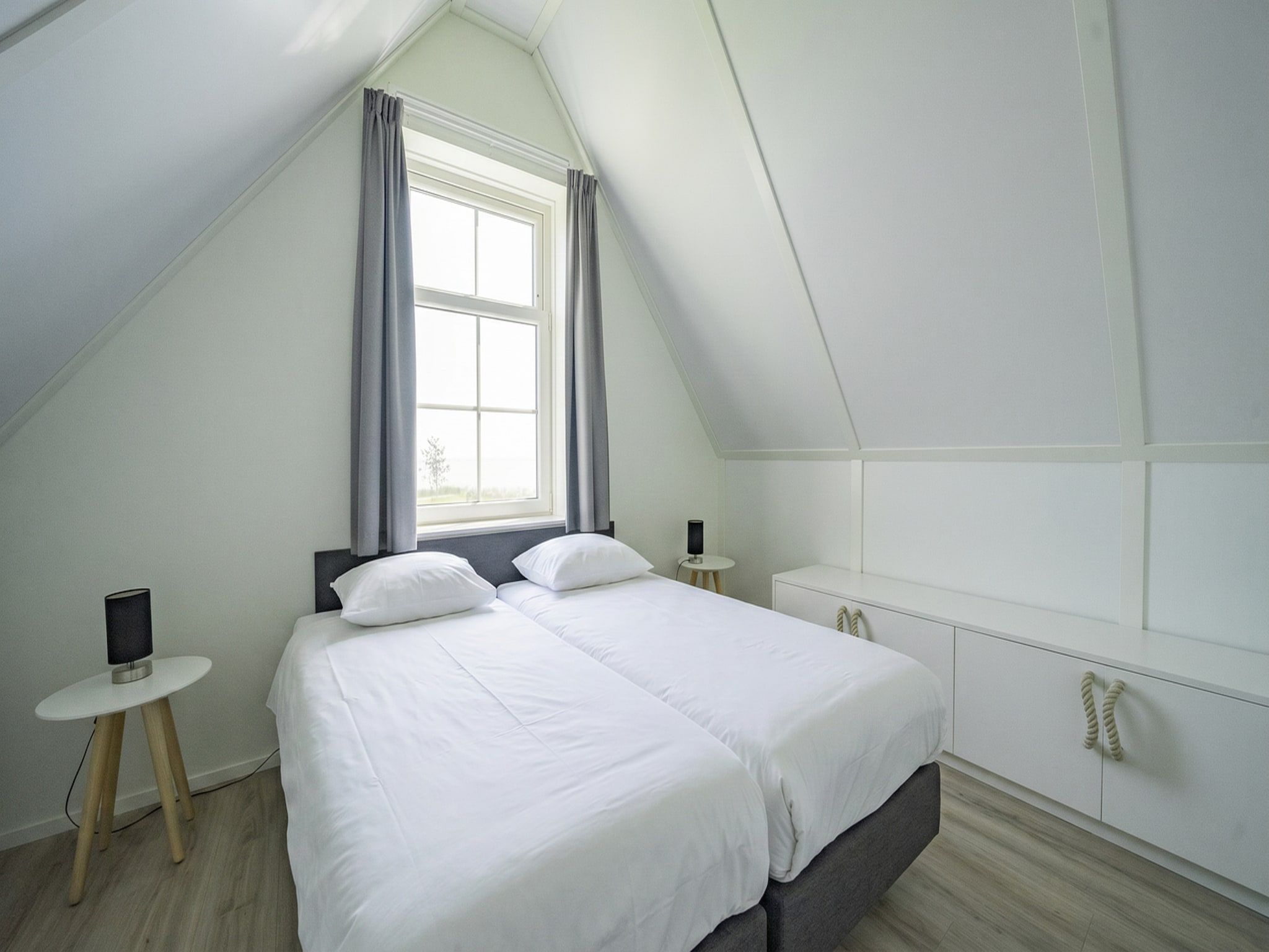 Een slaapkamer van 	Florijn 6 in Uitdam