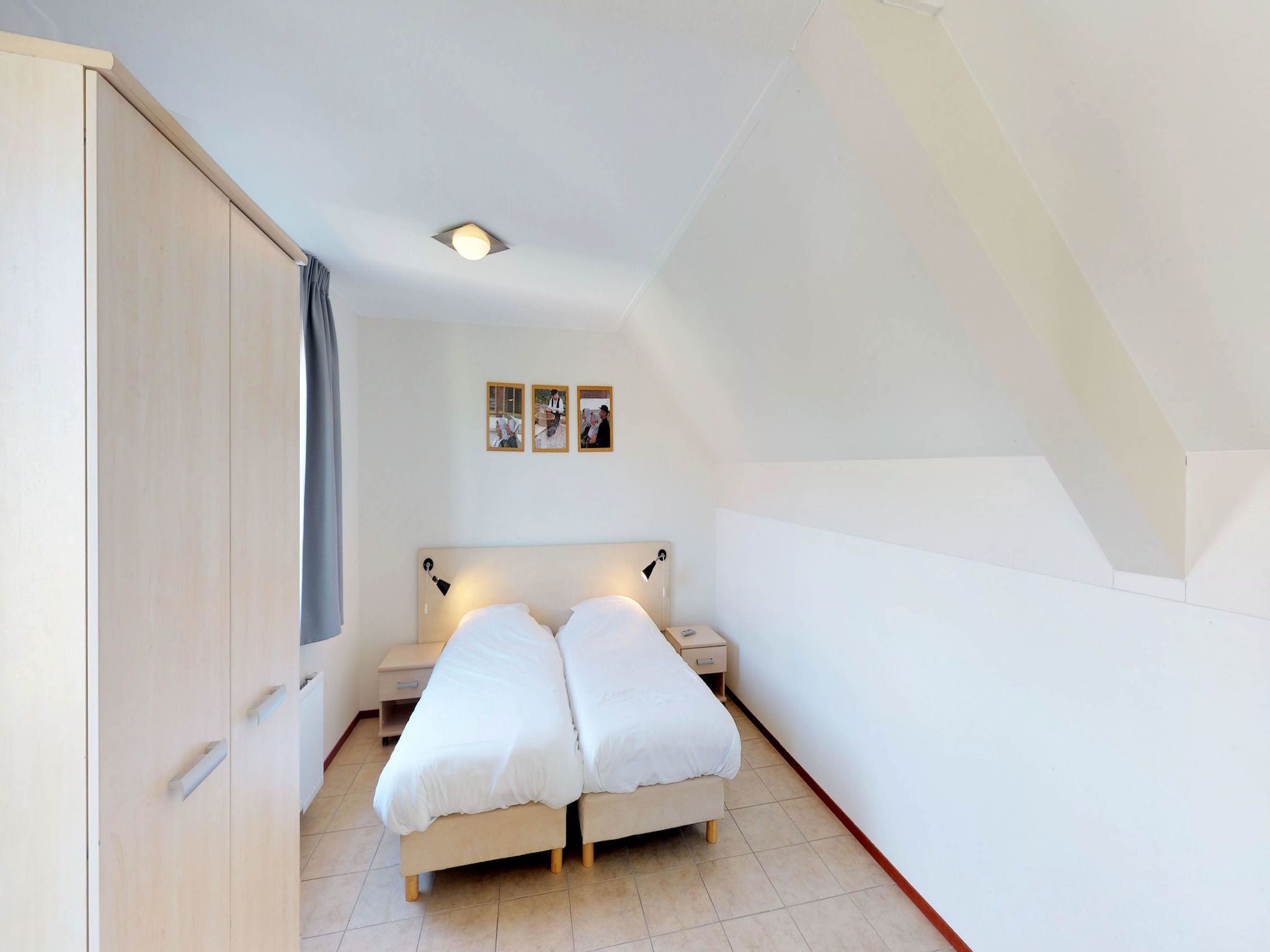 Een slaapkamer van Villapark de Paardekreek 6 in Kortgene