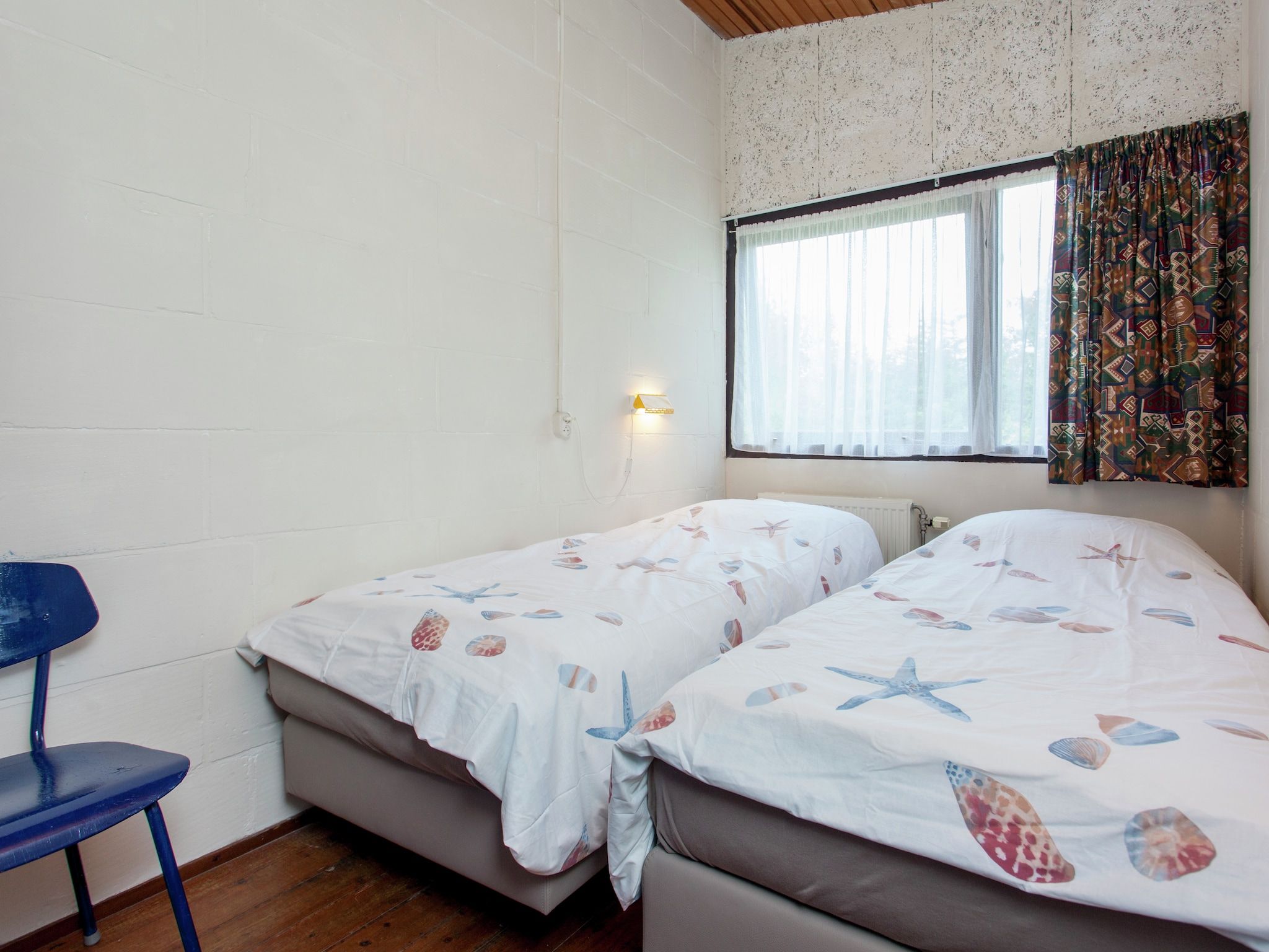 Een slaapkamer van Skries in Nes Ameland