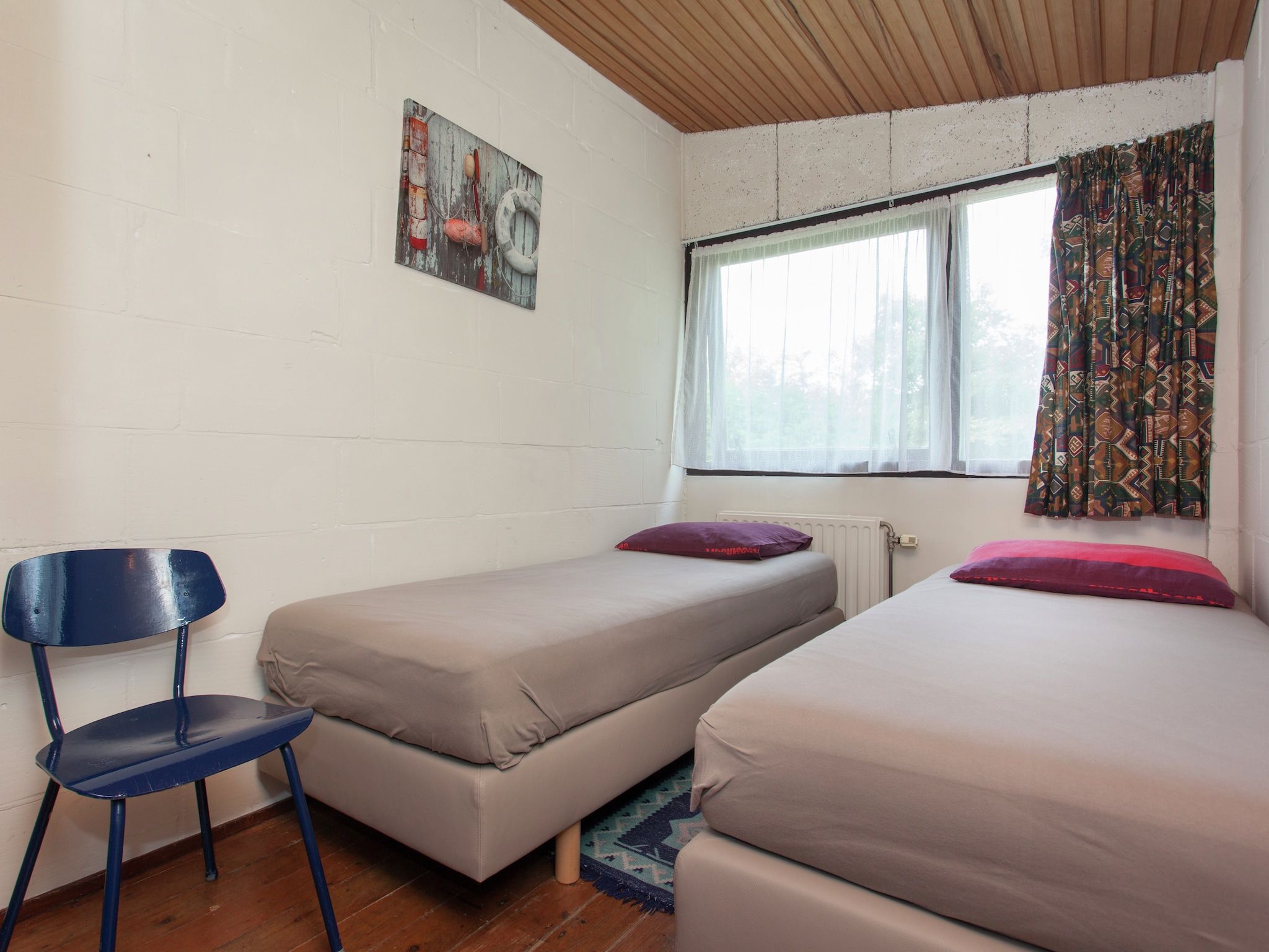 Een slaapkamer van Skries in Nes Ameland