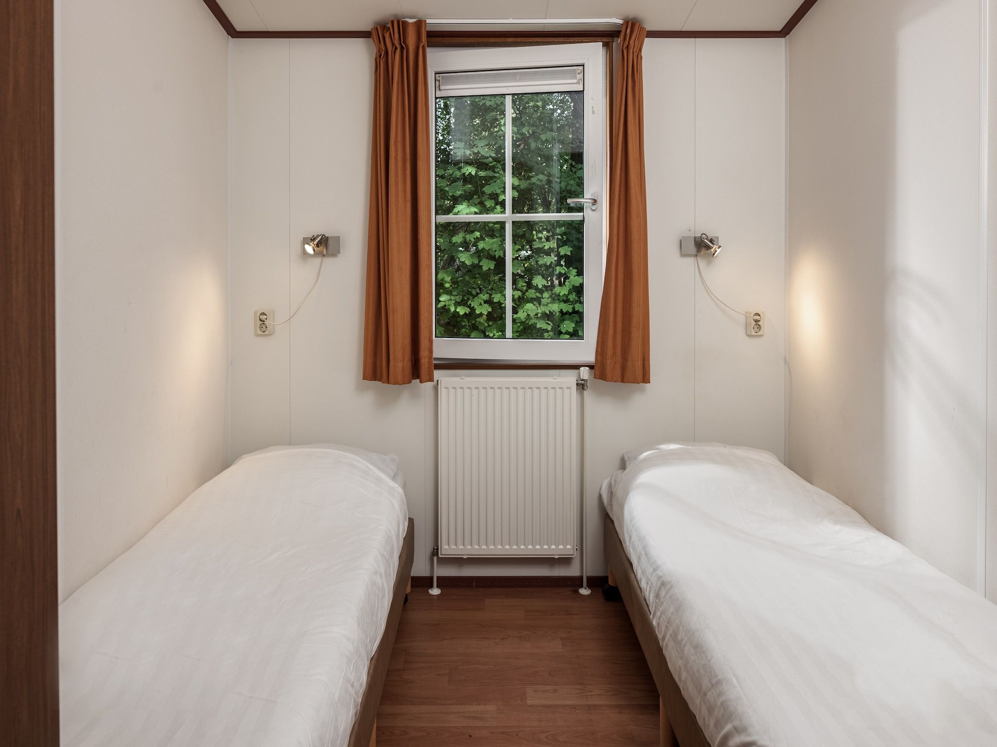 Een slaapkamer van Bospark Lunsbergen 5 in Borger