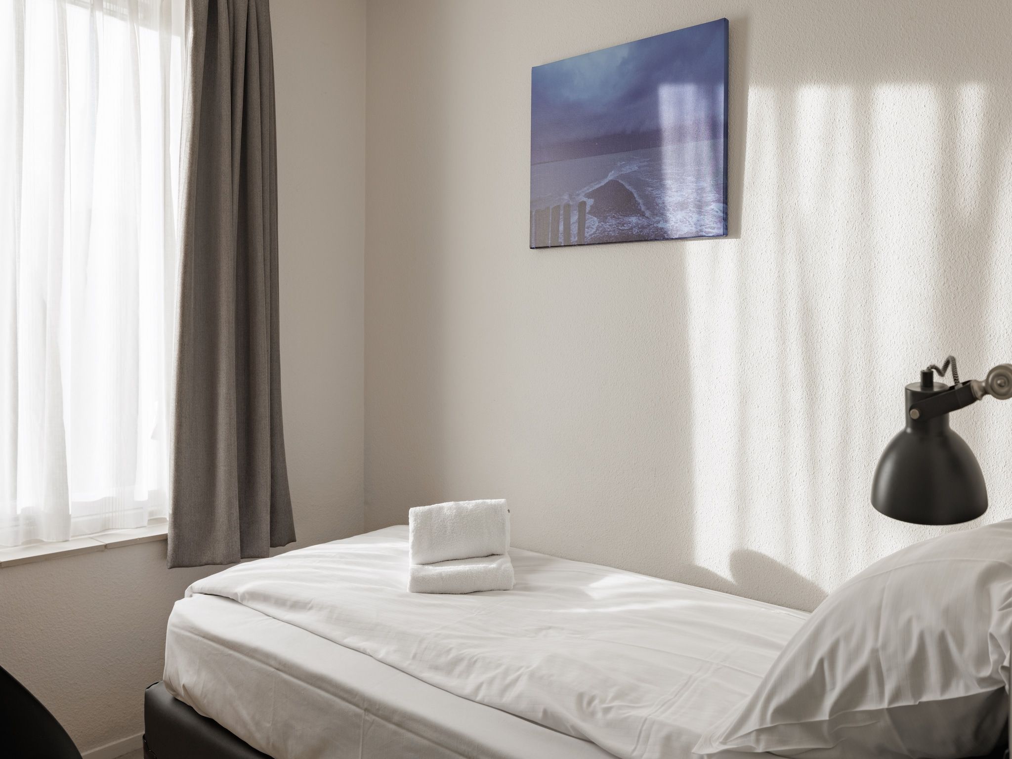 Een slaapkamer van Roompot Beach Resort 4 in Kamperland