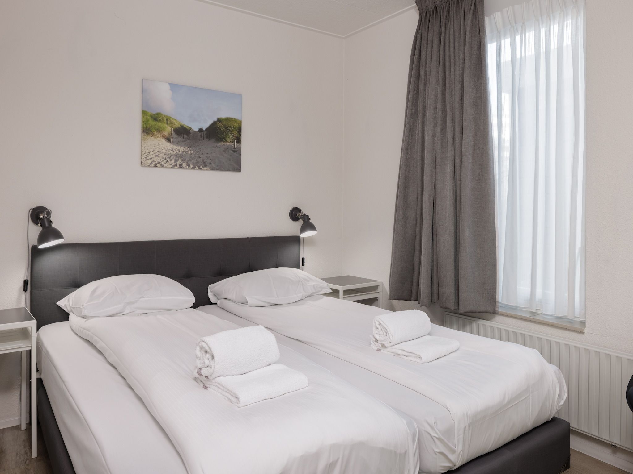 Een slaapkamer van Roompot Beach Resort 4 in Kamperland