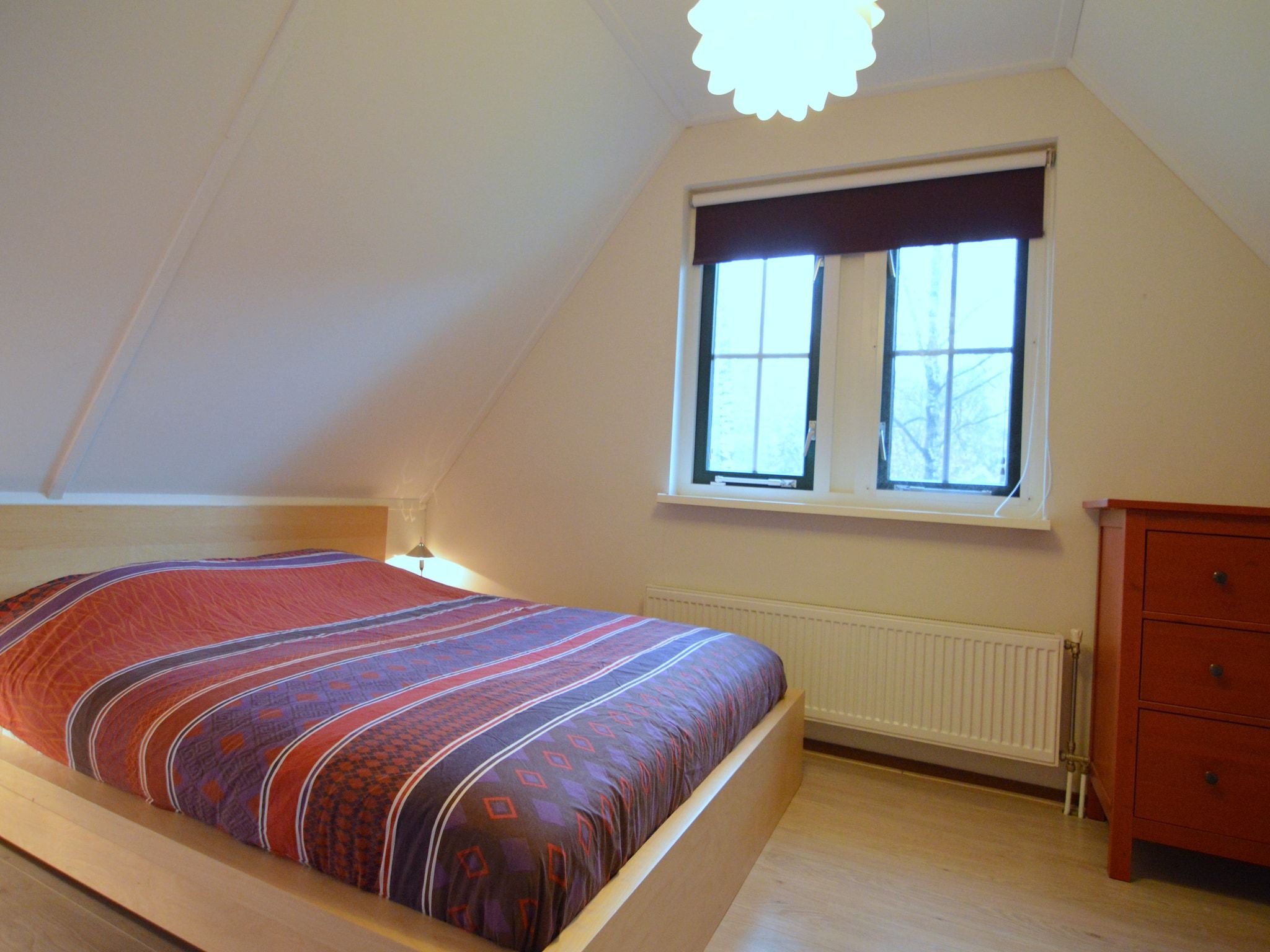 Een slaapkamer van Wildeman in Heeten