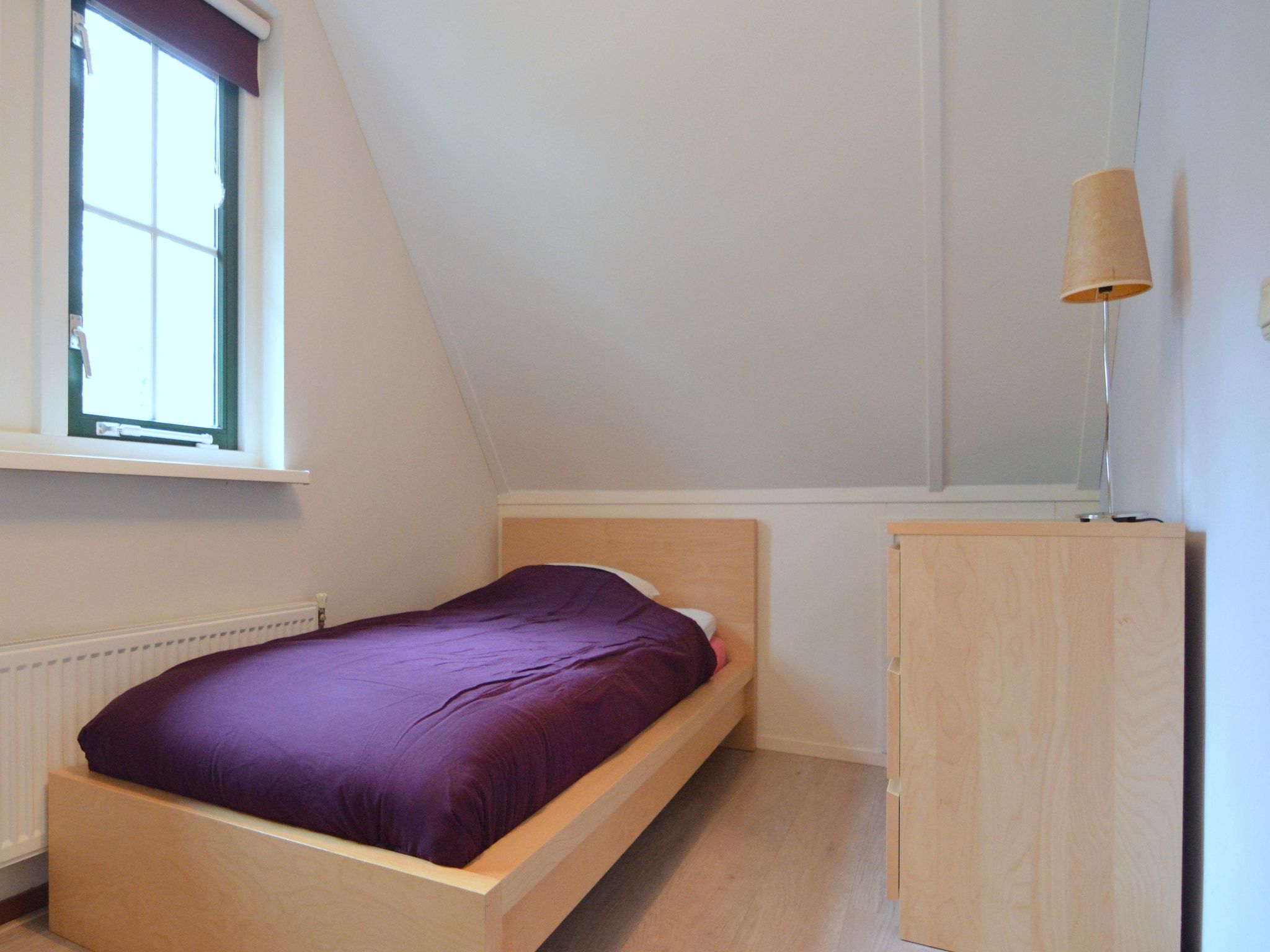 Een slaapkamer van Wildeman in Heeten