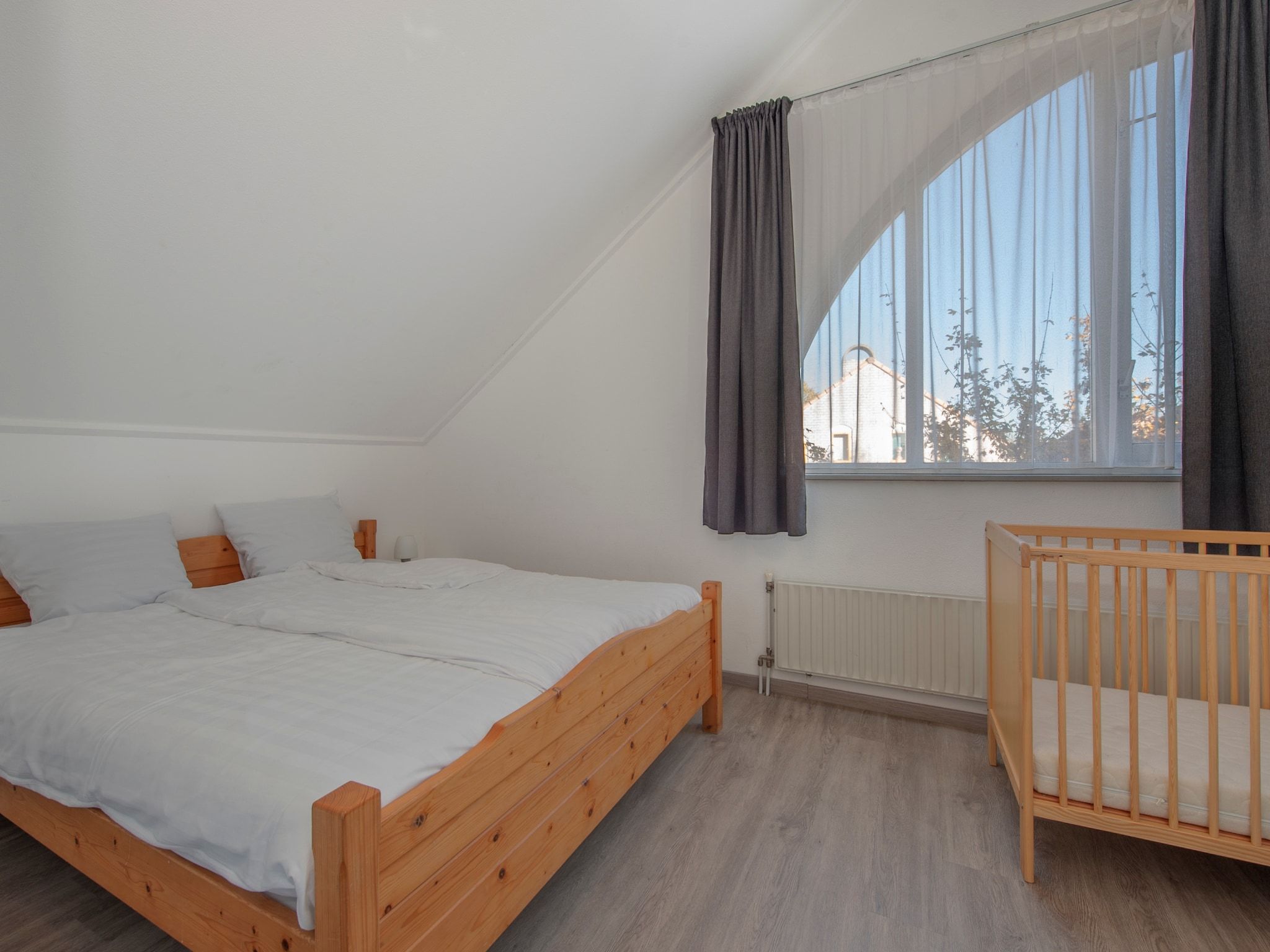 Een slaapkamer van Vakantiepark Zeebad 2 in Breskens