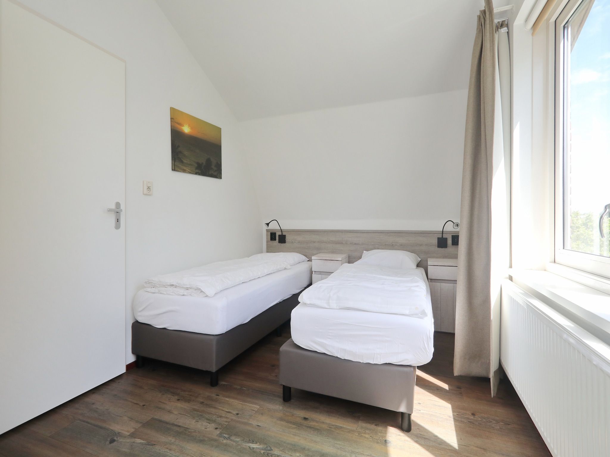 Een slaapkamer van Vakantiepark Duinrust 1 in Noordwijk aan zee