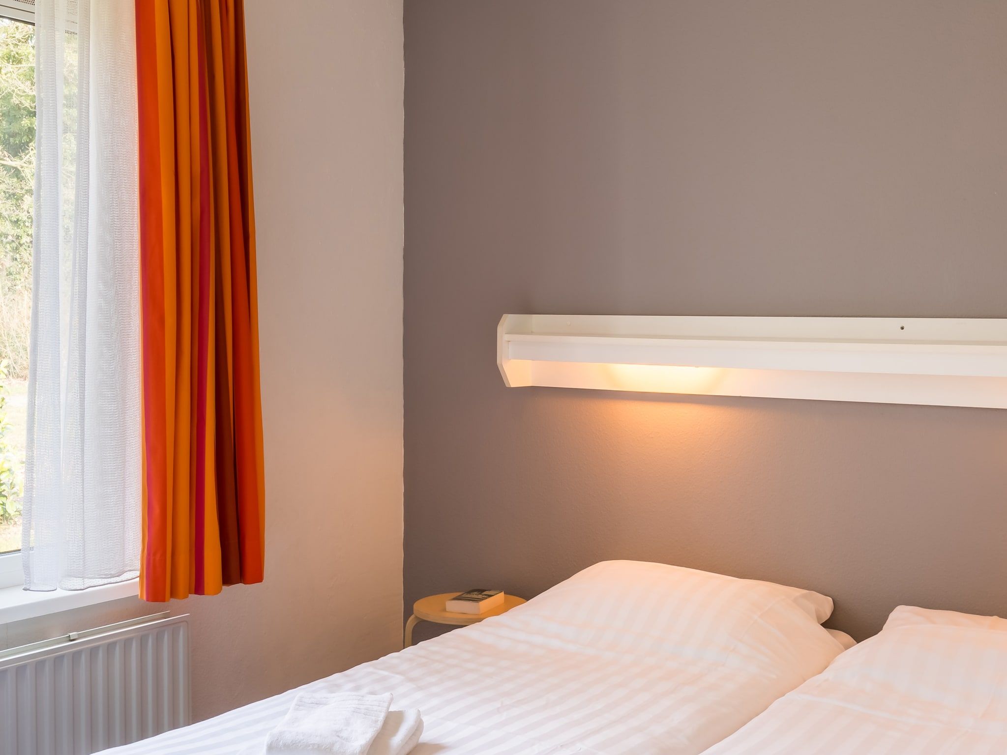 Een slaapkamer van Vakantiepark Hunzedal 6 in Borger