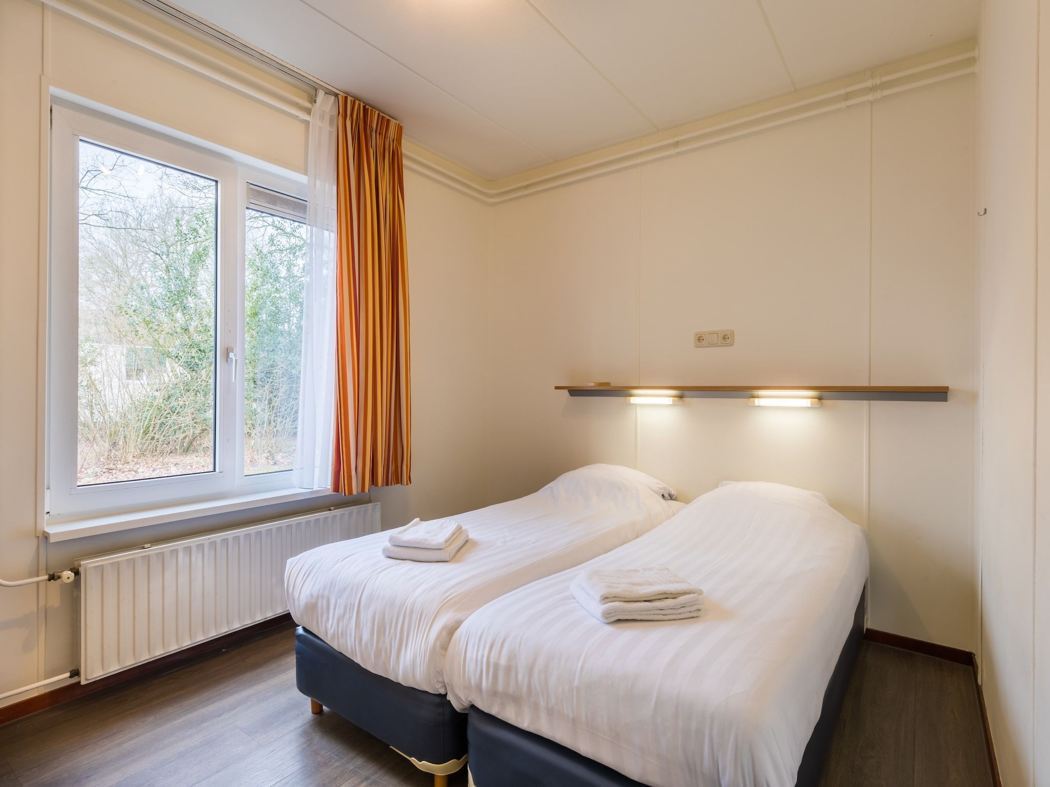 Een slaapkamer van Vakantiepark Hunzedal 5 in Borger