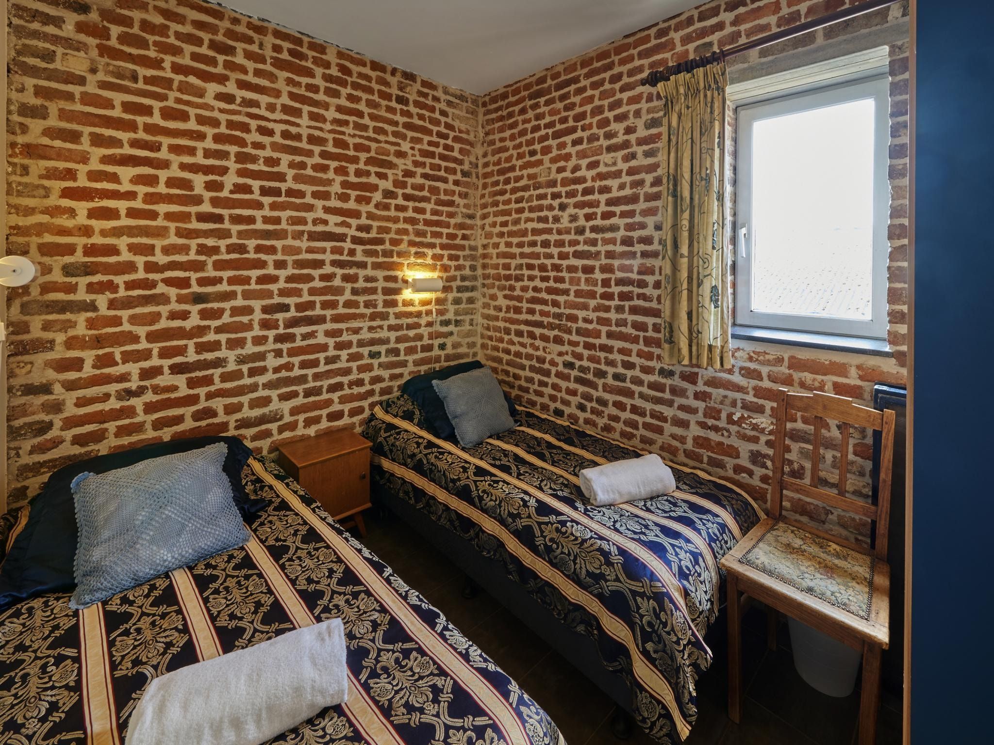 Een slaapkamer van Meschermolen 10 in Mesch-Eijsden