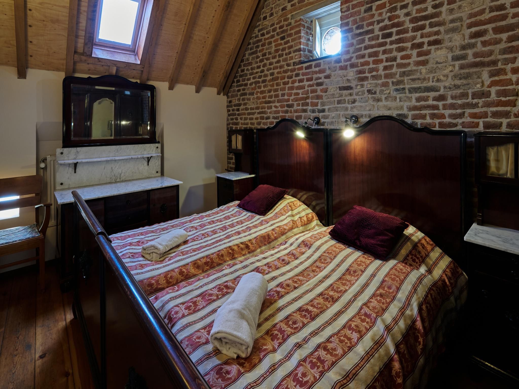 Een slaapkamer van Meschermolen 10 in Mesch-Eijsden