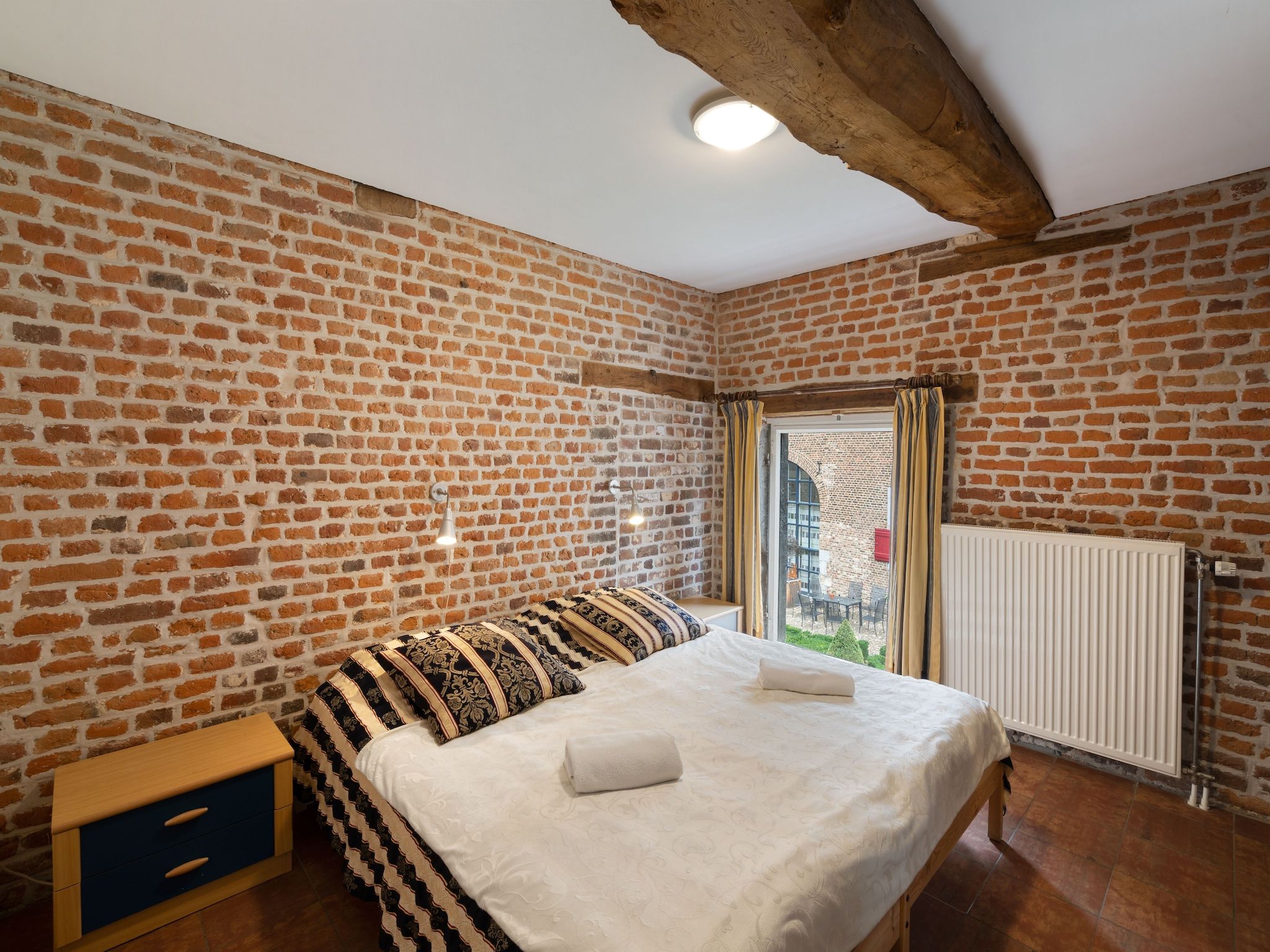 Een slaapkamer van Meschermolen 6 in Mesch-Eijsden