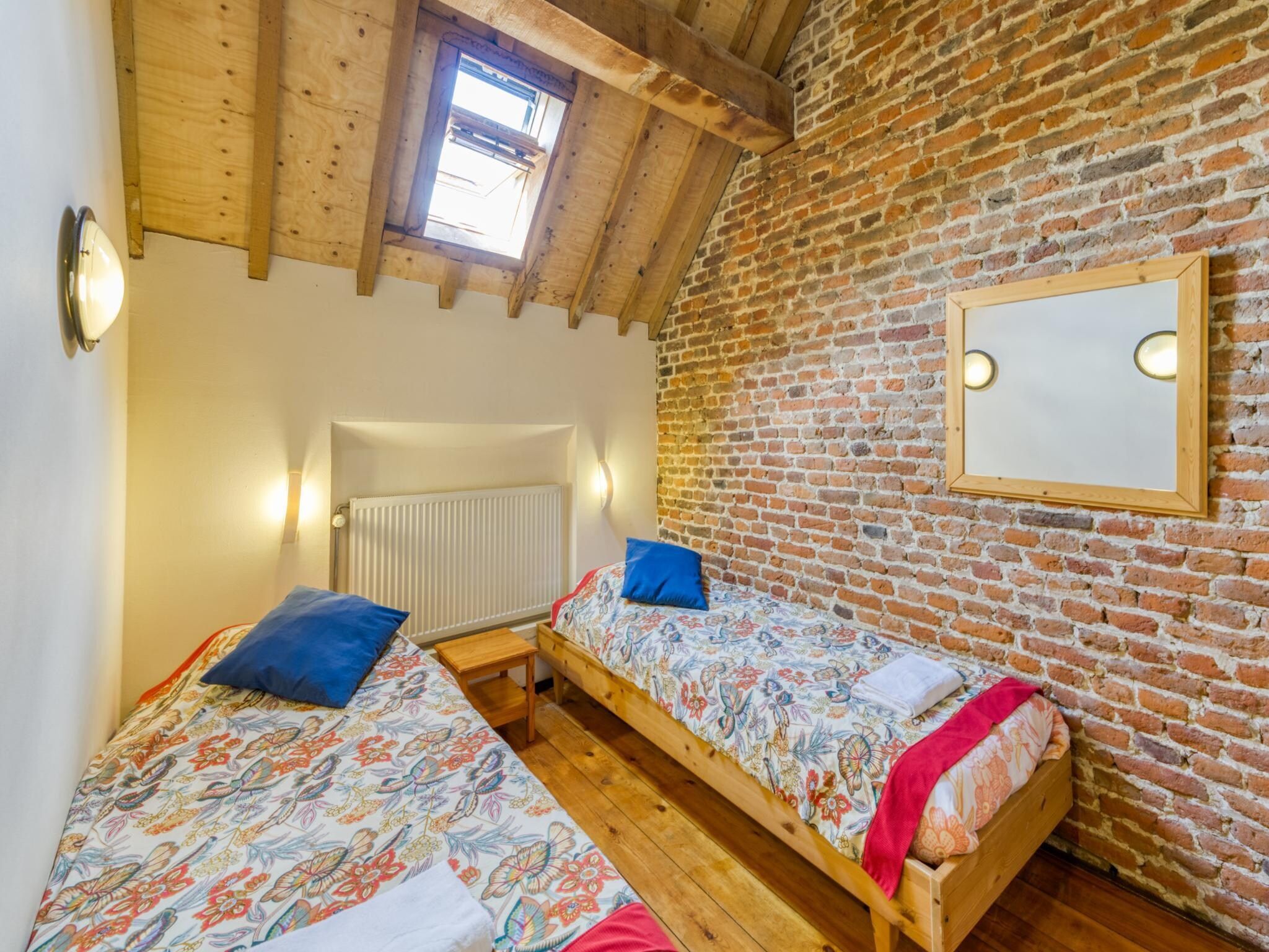 Een slaapkamer van Meschermolen 6 in Mesch-Eijsden