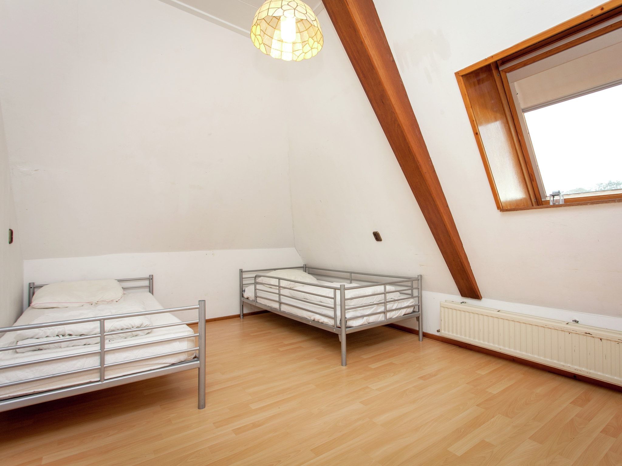 Een slaapkamer van De Vakantie boerderij in Holwerd