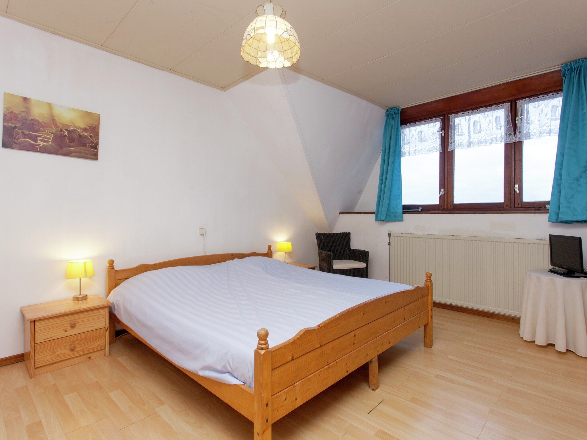 Een slaapkamer van De Vakantie boerderij in Holwerd