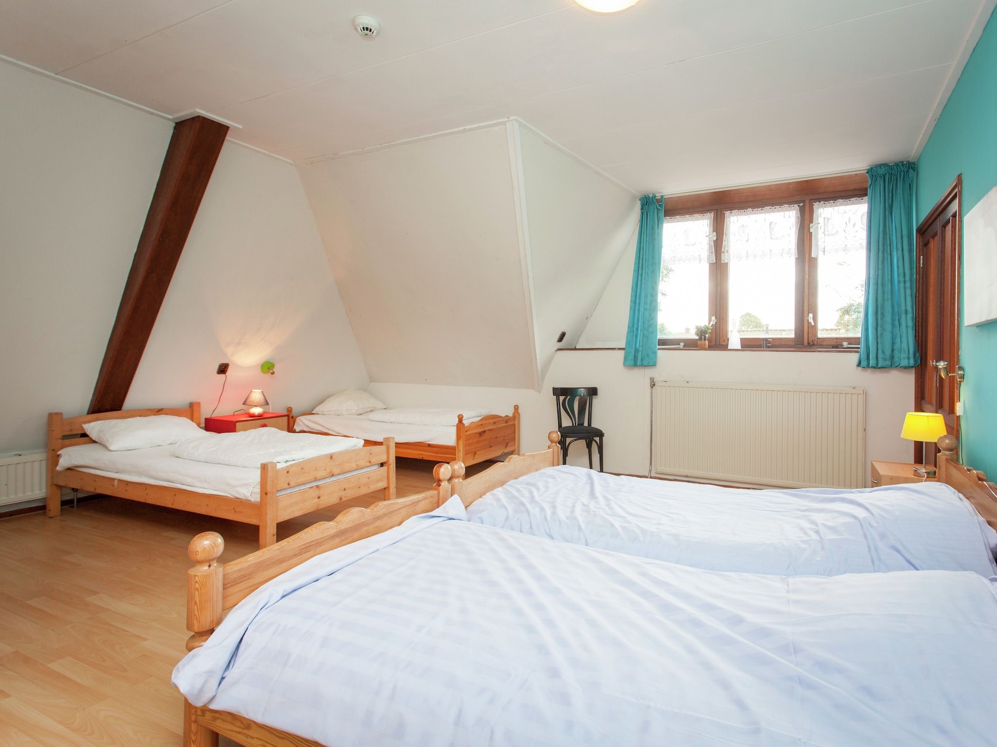 Een slaapkamer van De Vakantie boerderij in Holwerd