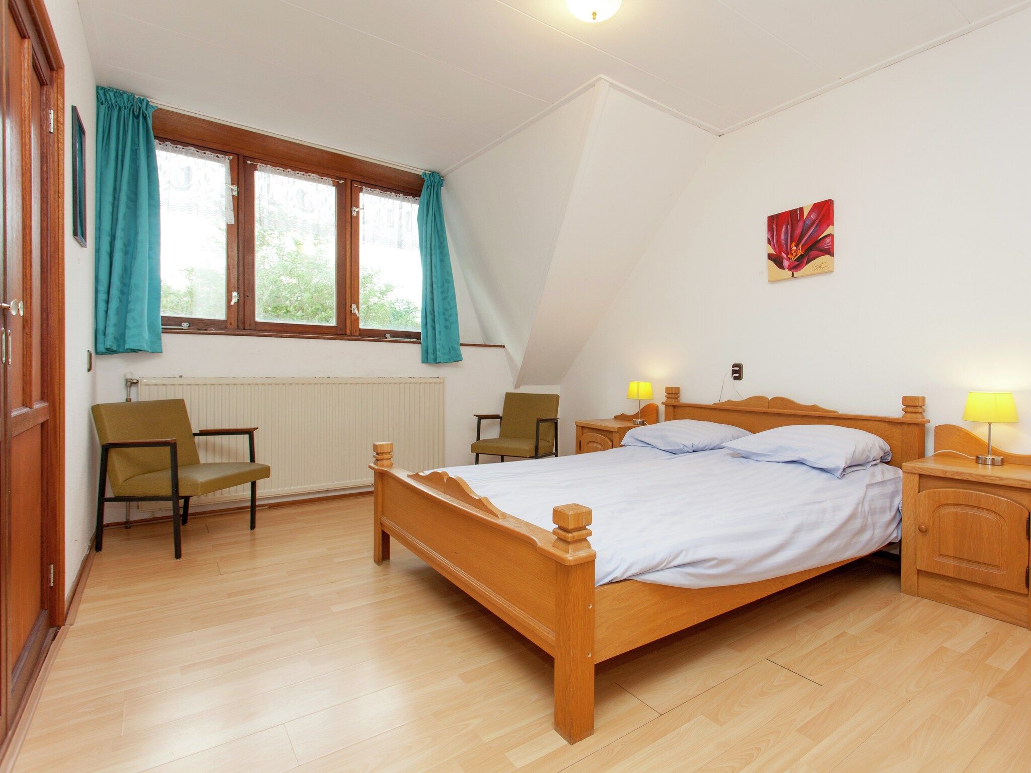 Een slaapkamer van De Vakantie boerderij in Holwerd