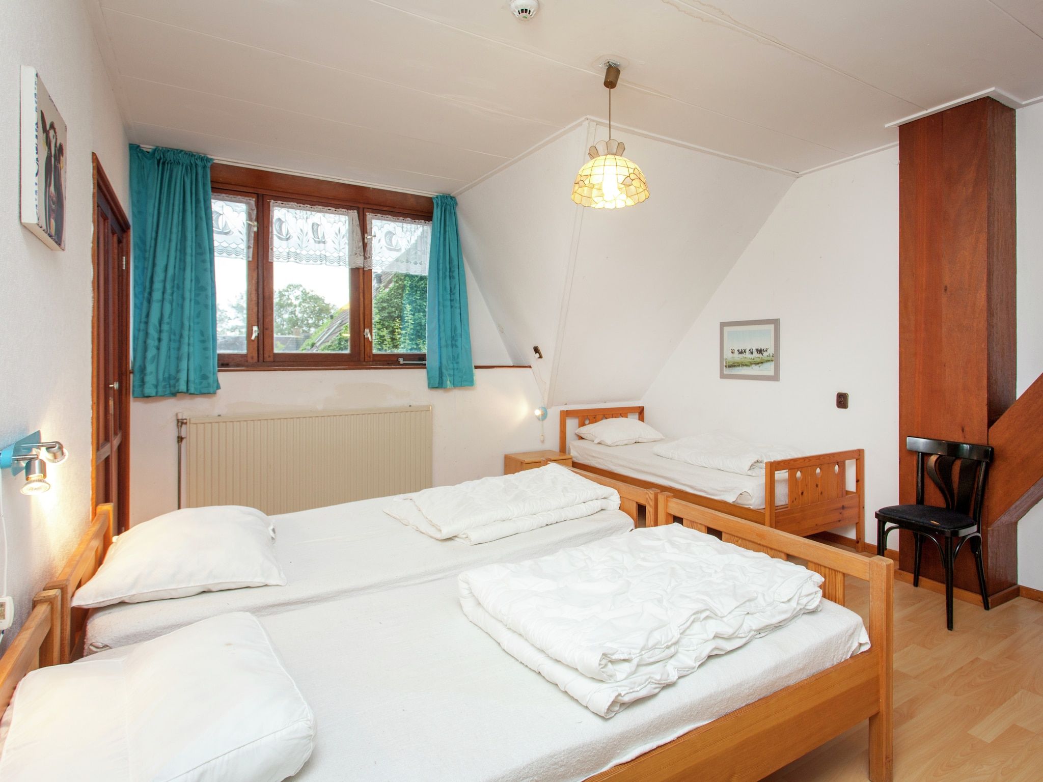 Een slaapkamer van De Vakantie boerderij in Holwerd