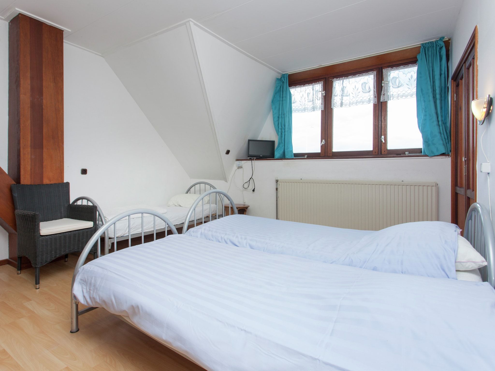 Een slaapkamer van De Vakantie boerderij in Holwerd