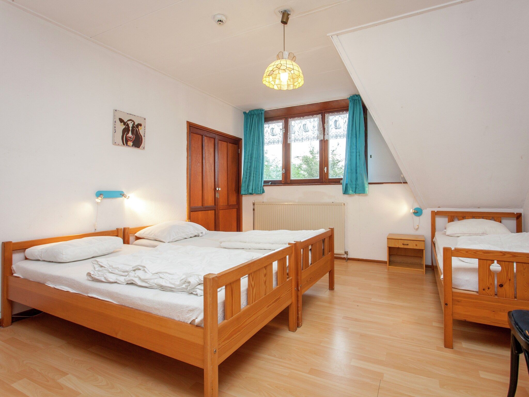 Een slaapkamer van De Vakantie boerderij in Holwerd