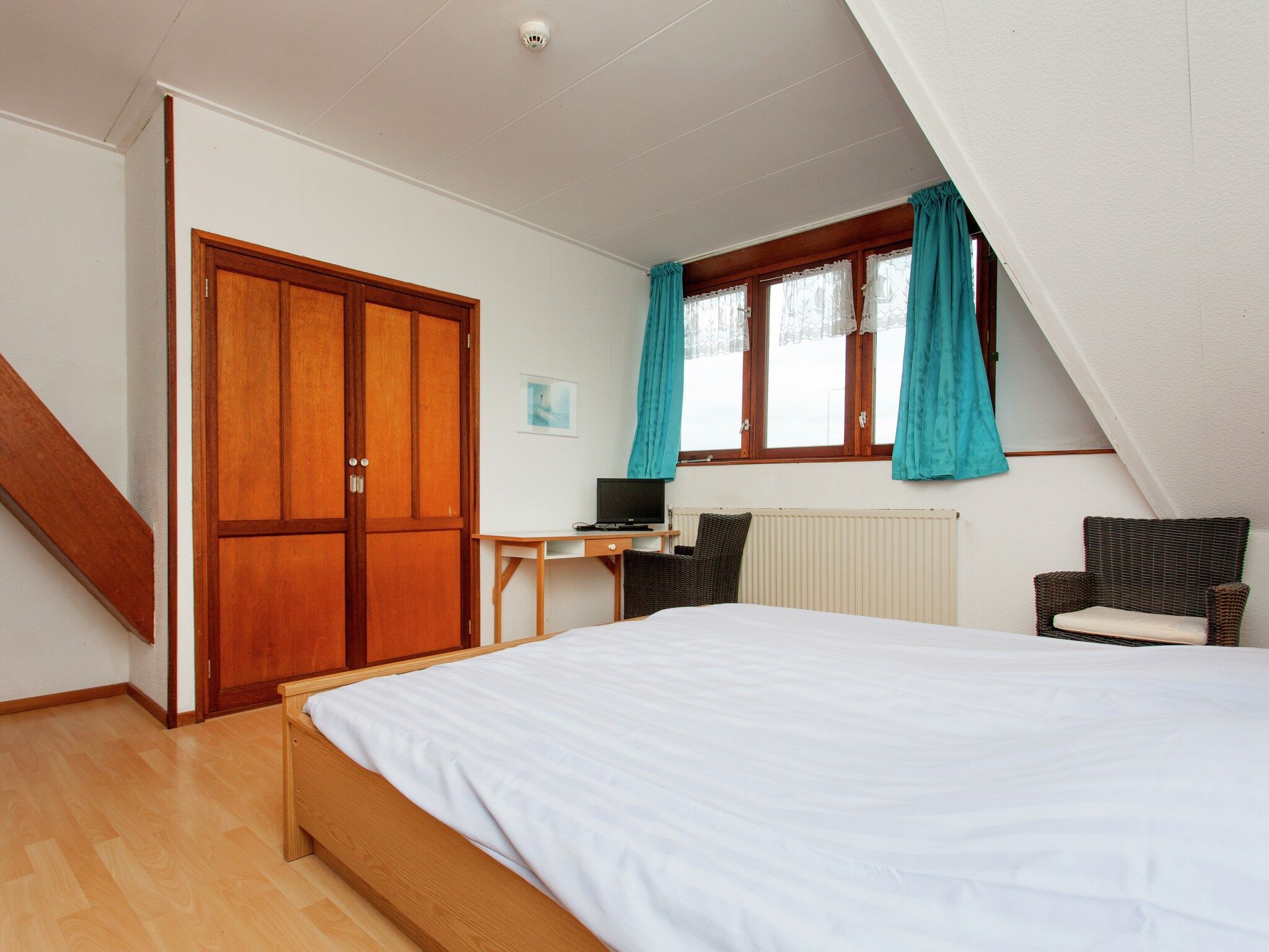 Een slaapkamer van De Vakantie boerderij in Holwerd