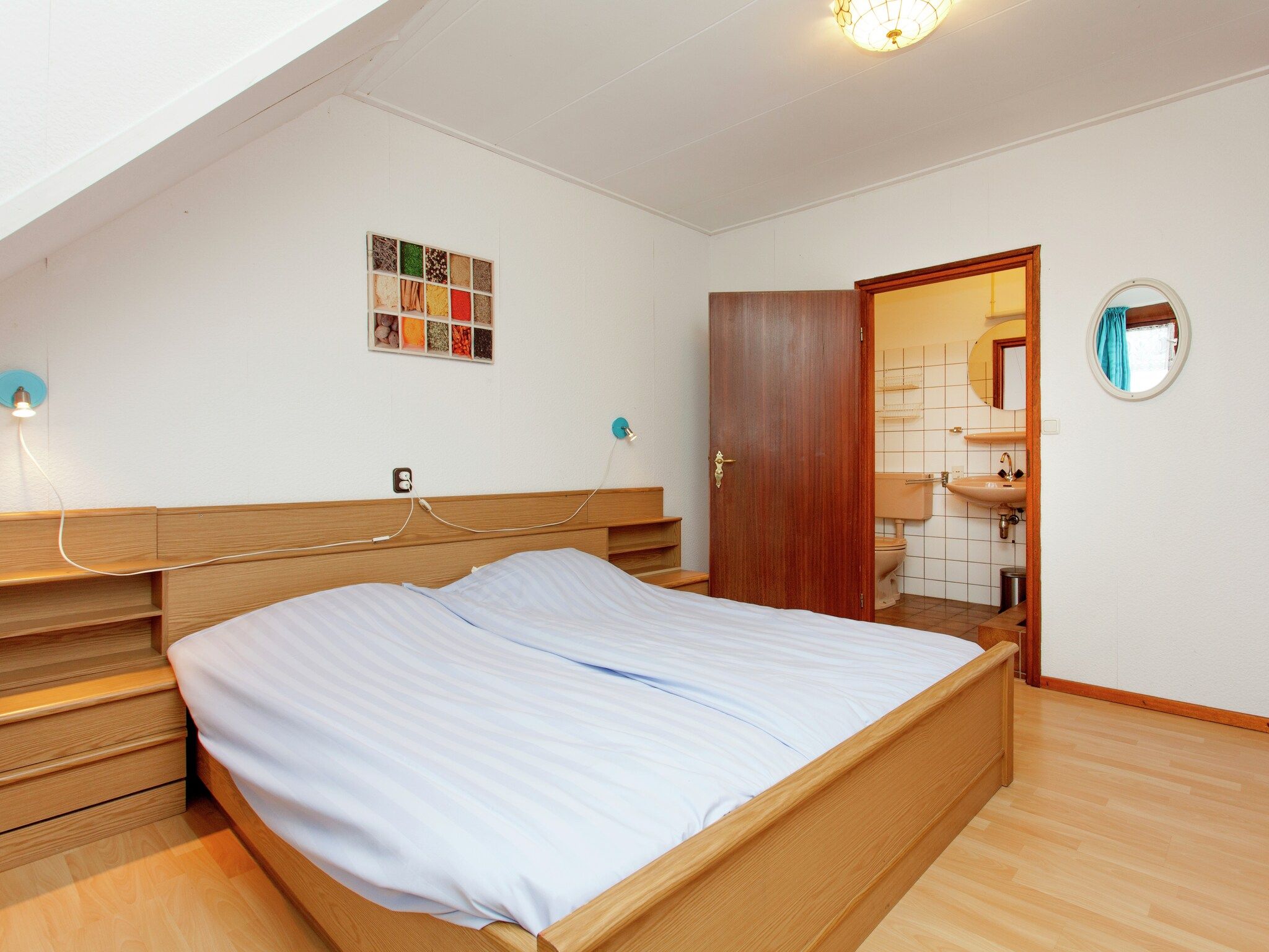 Een slaapkamer van De Vakantie boerderij in Holwerd