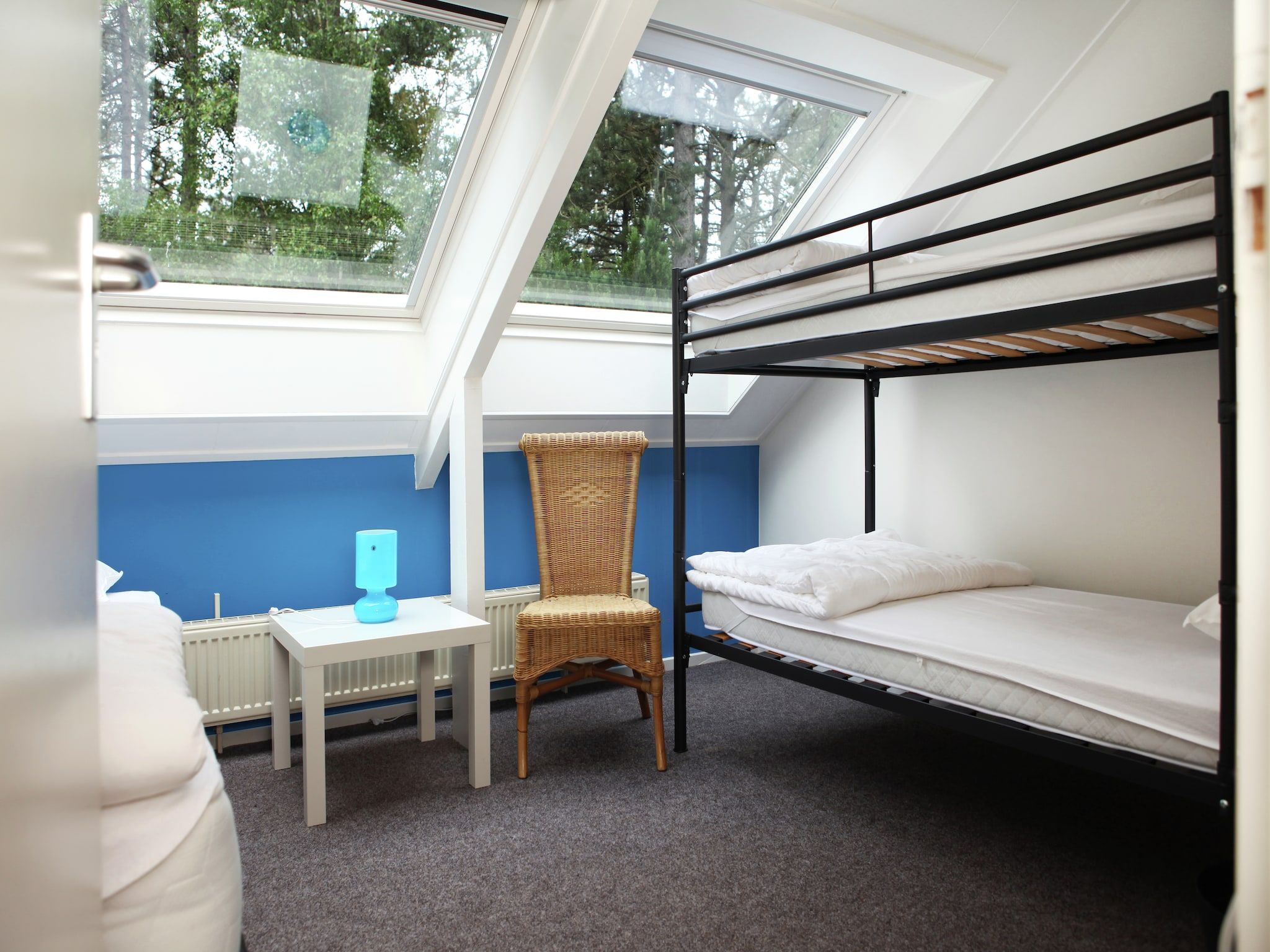 Een slaapkamer van De grove Den in Doornspijk