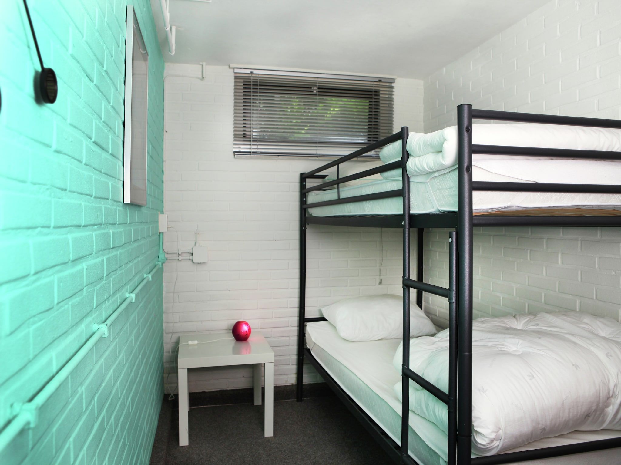 Een slaapkamer van De grove Den in Doornspijk