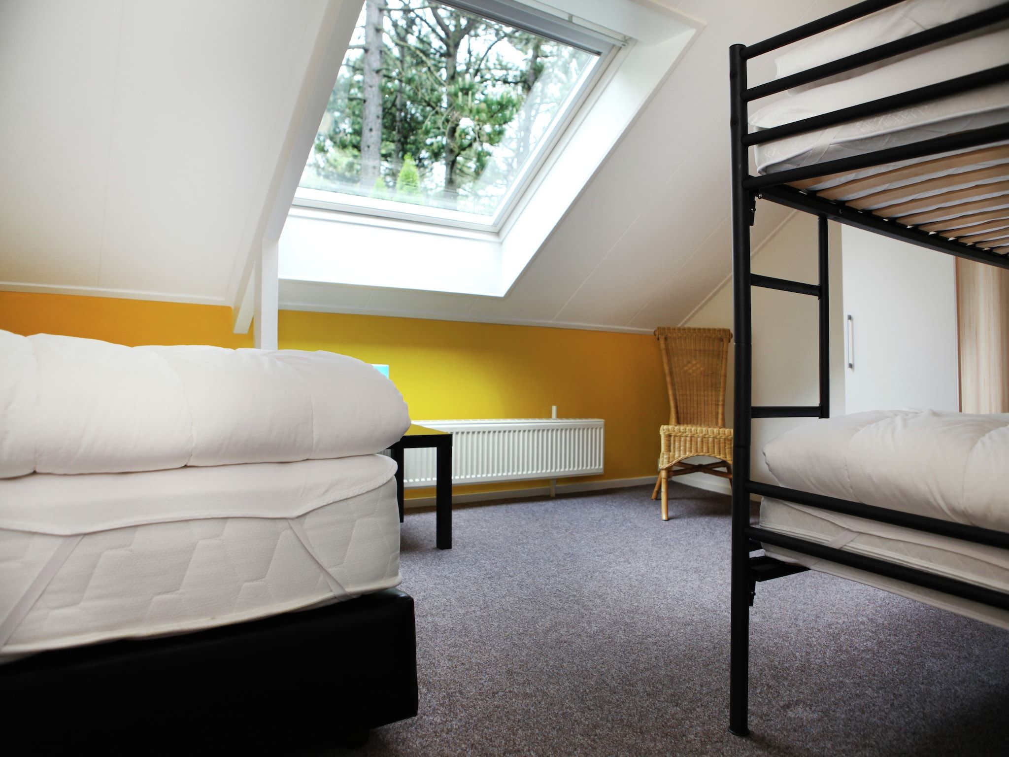 Een slaapkamer van De grove Den in Doornspijk