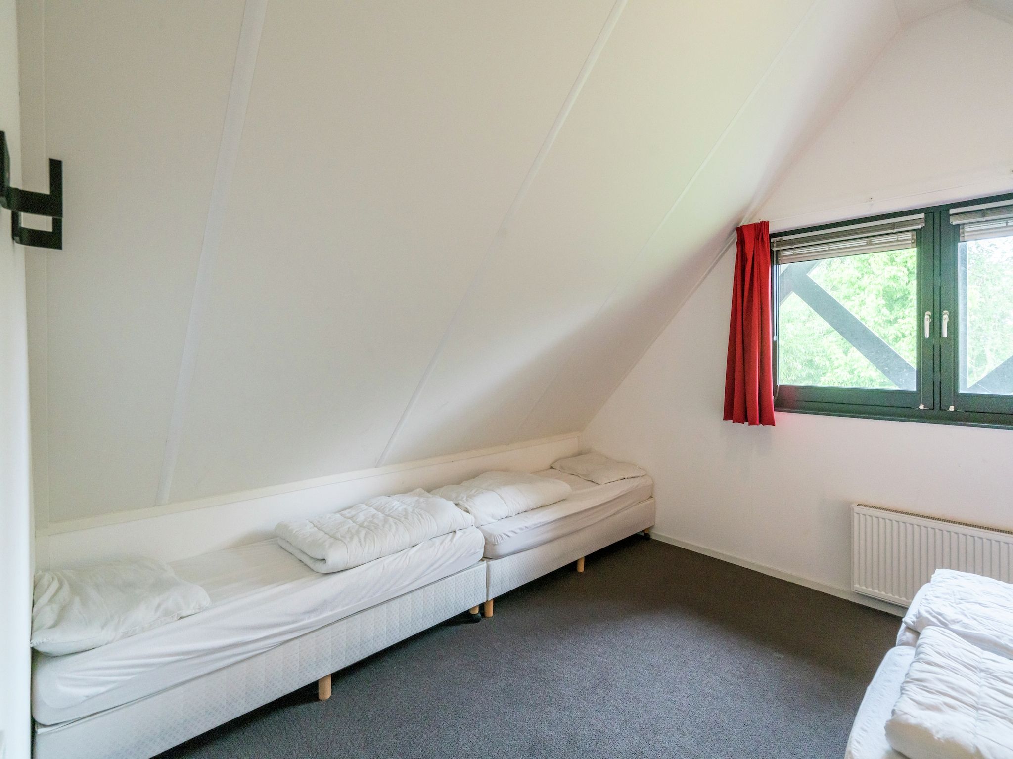 Een slaapkamer van Huize Lewis in Balk