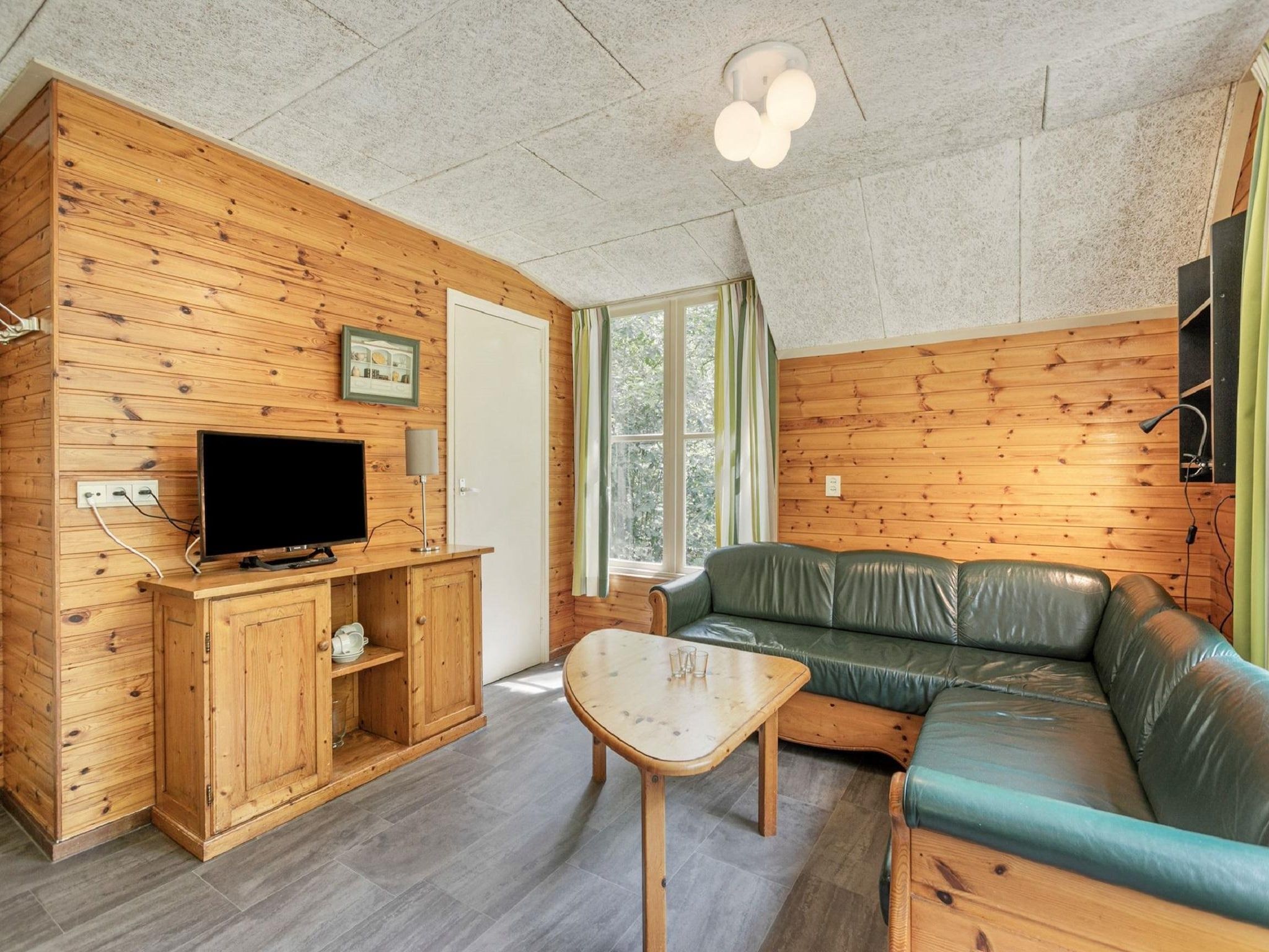 De woonkamer van Vakantiepark Herperduin 1 in Herpen