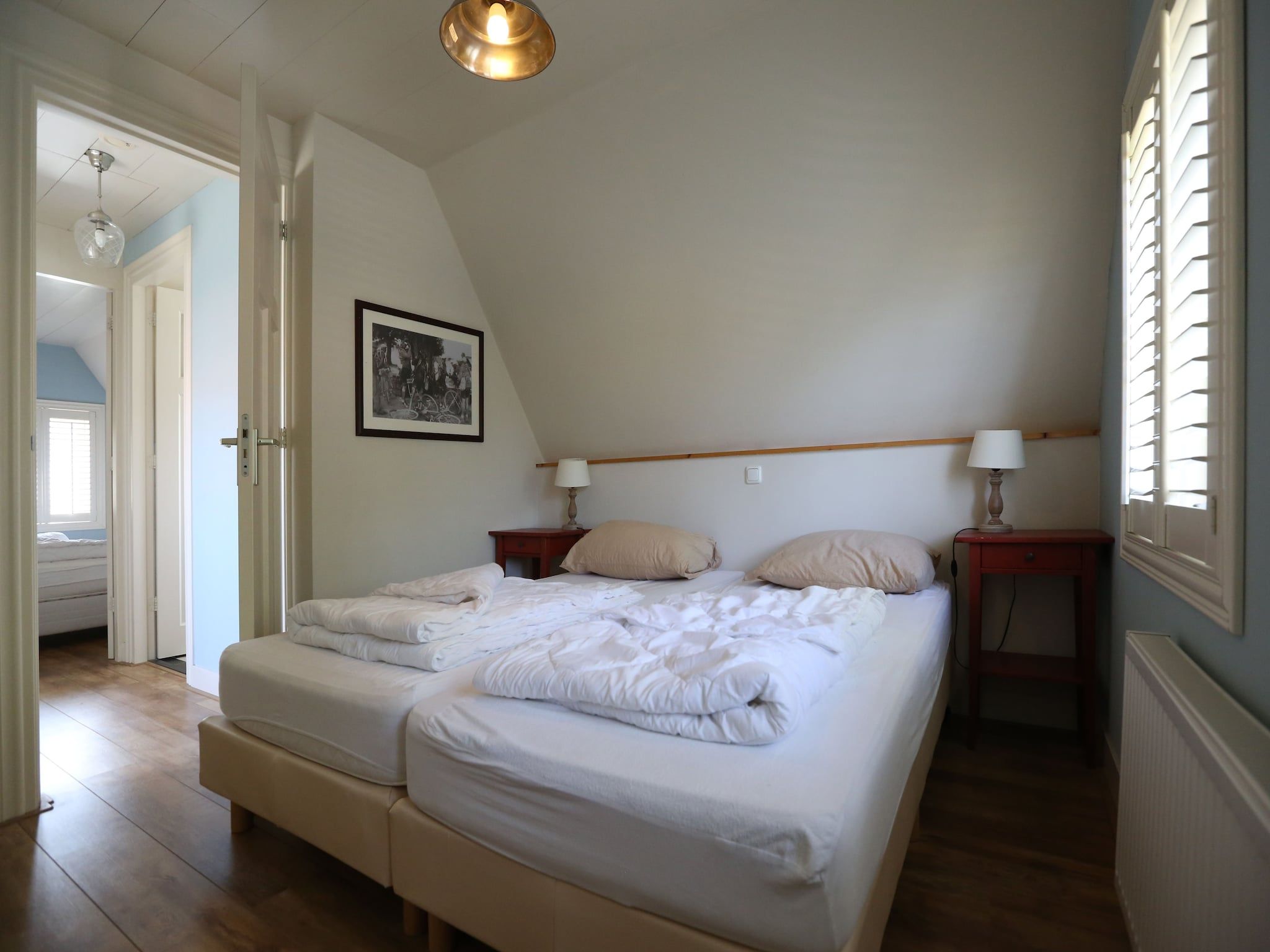 Een slaapkamer van Recreatiepark Wiringherlant  - Villa 4 in Hippolytushoef