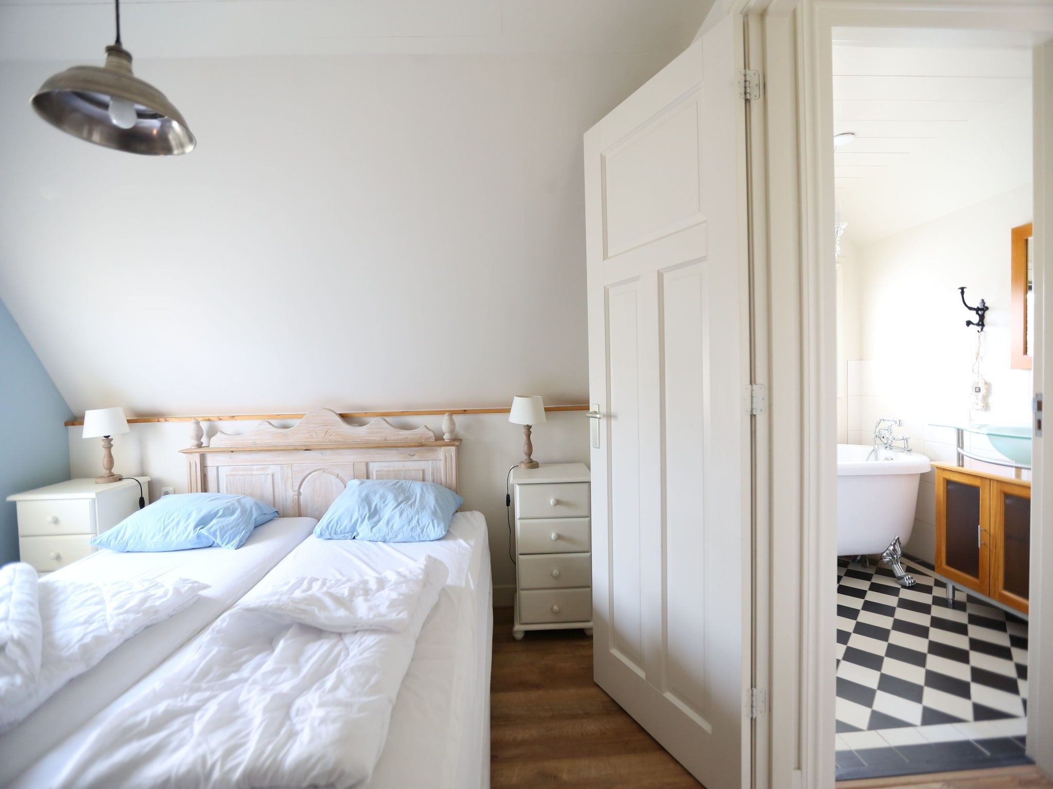 Een slaapkamer van Recreatiepark Wiringherlant  - Villa 4 in Hippolytushoef