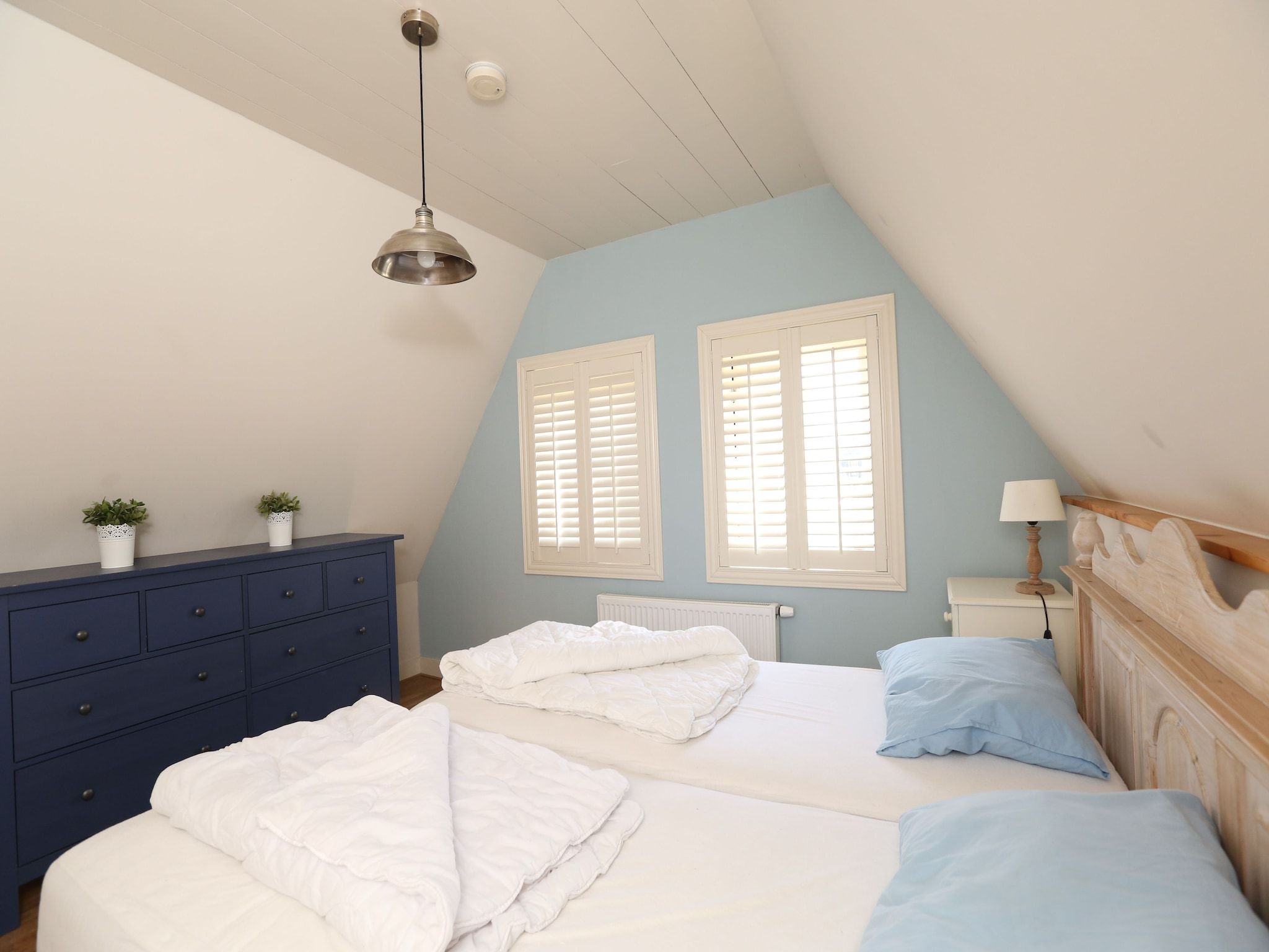 Een slaapkamer van Recreatiepark Wiringherlant  - Villa 4 in Hippolytushoef