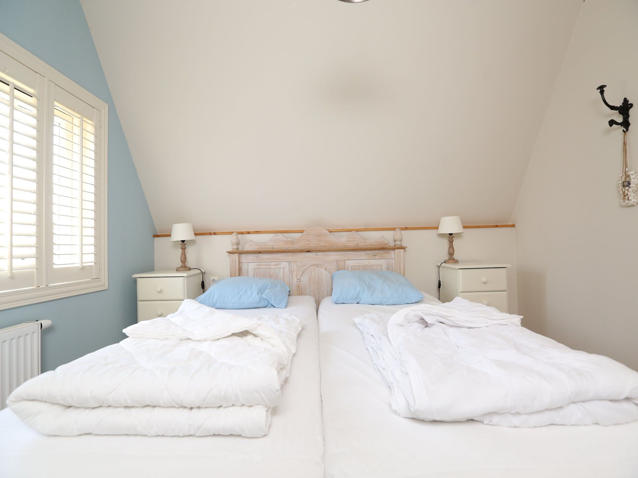 Een slaapkamer van Recreatiepark Wiringherlant  - Villa 4 in Hippolytushoef