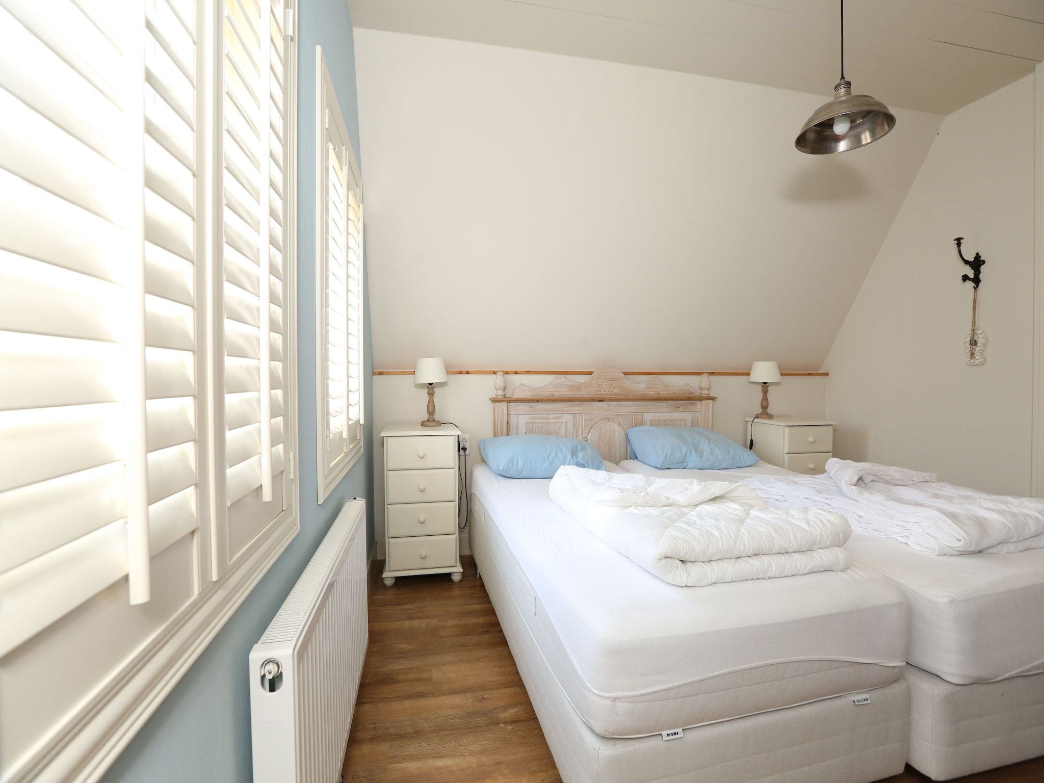 Een slaapkamer van Recreatiepark Wiringherlant  - Villa 4 in Hippolytushoef