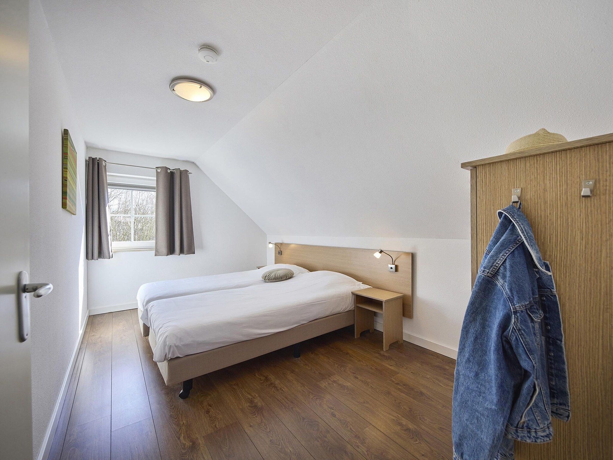 Een slaapkamer van Buitenhof De Leistert 11 in Roggel