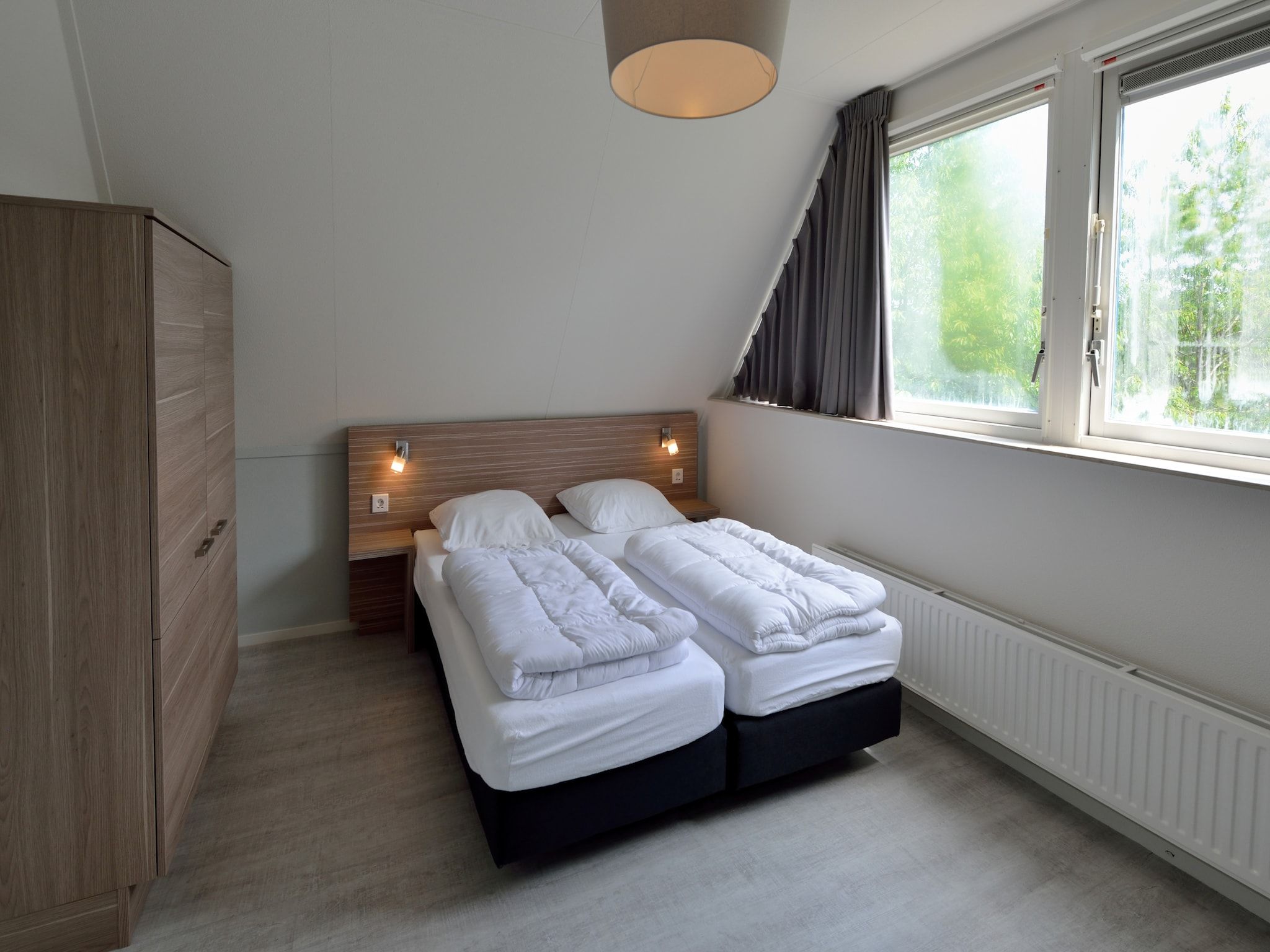 Een slaapkamer van Villapark Schildmeer 2 in Steendam