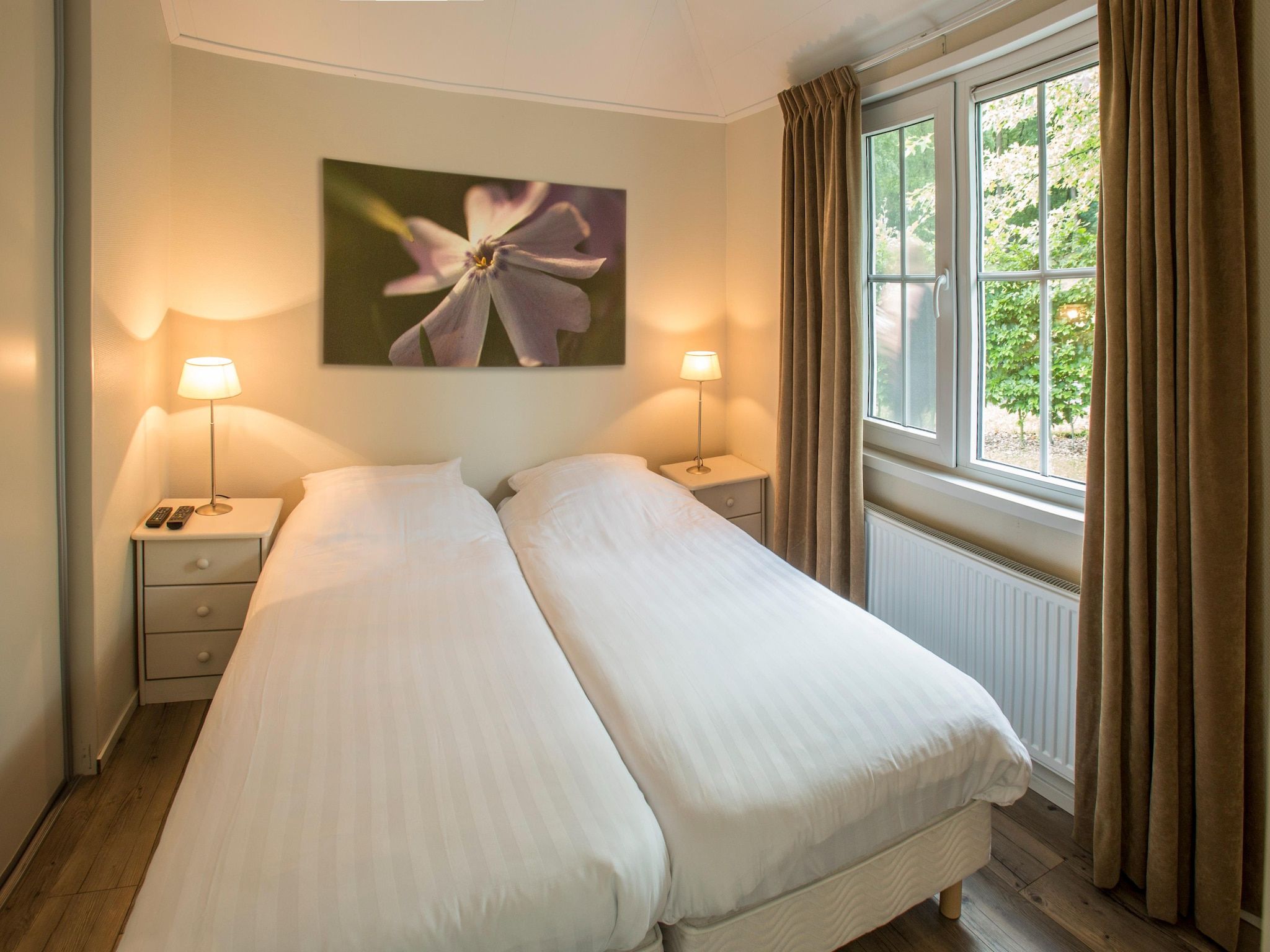 Een slaapkamer van Recreatiepark Tolplas 1 in Hoge Hexel