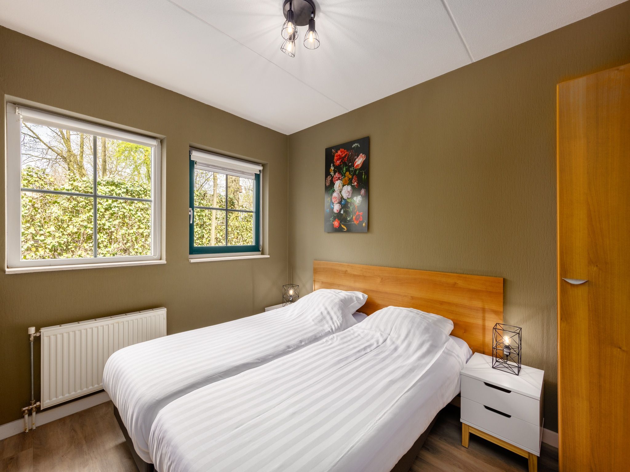 Een slaapkamer van Recreatiepark Tolplas 10 in Hoge Hexel