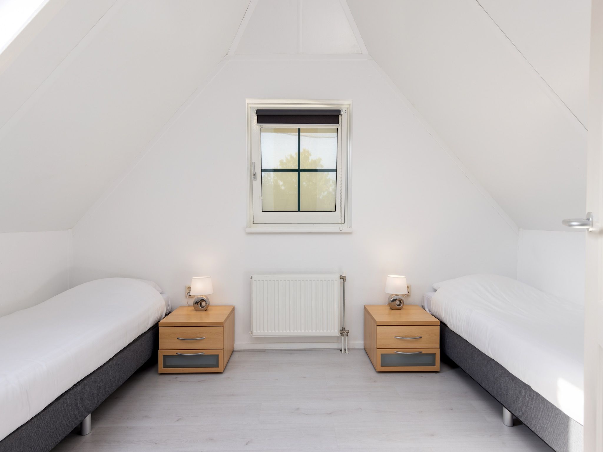 Een slaapkamer van Recreatiepark Tolplas 11 in Hoge Hexel